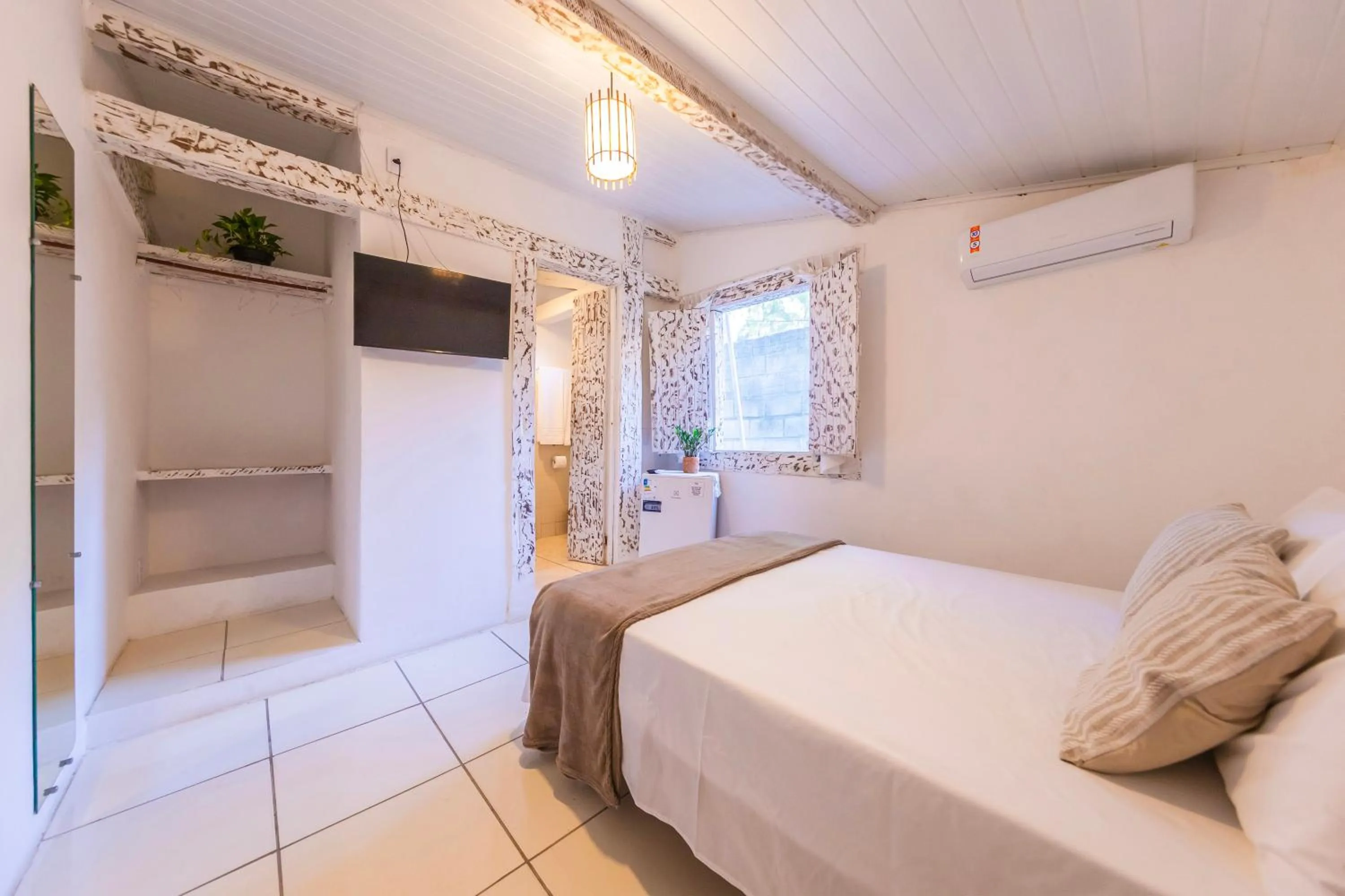 Bed in Pousada Arraial dos Sonhos