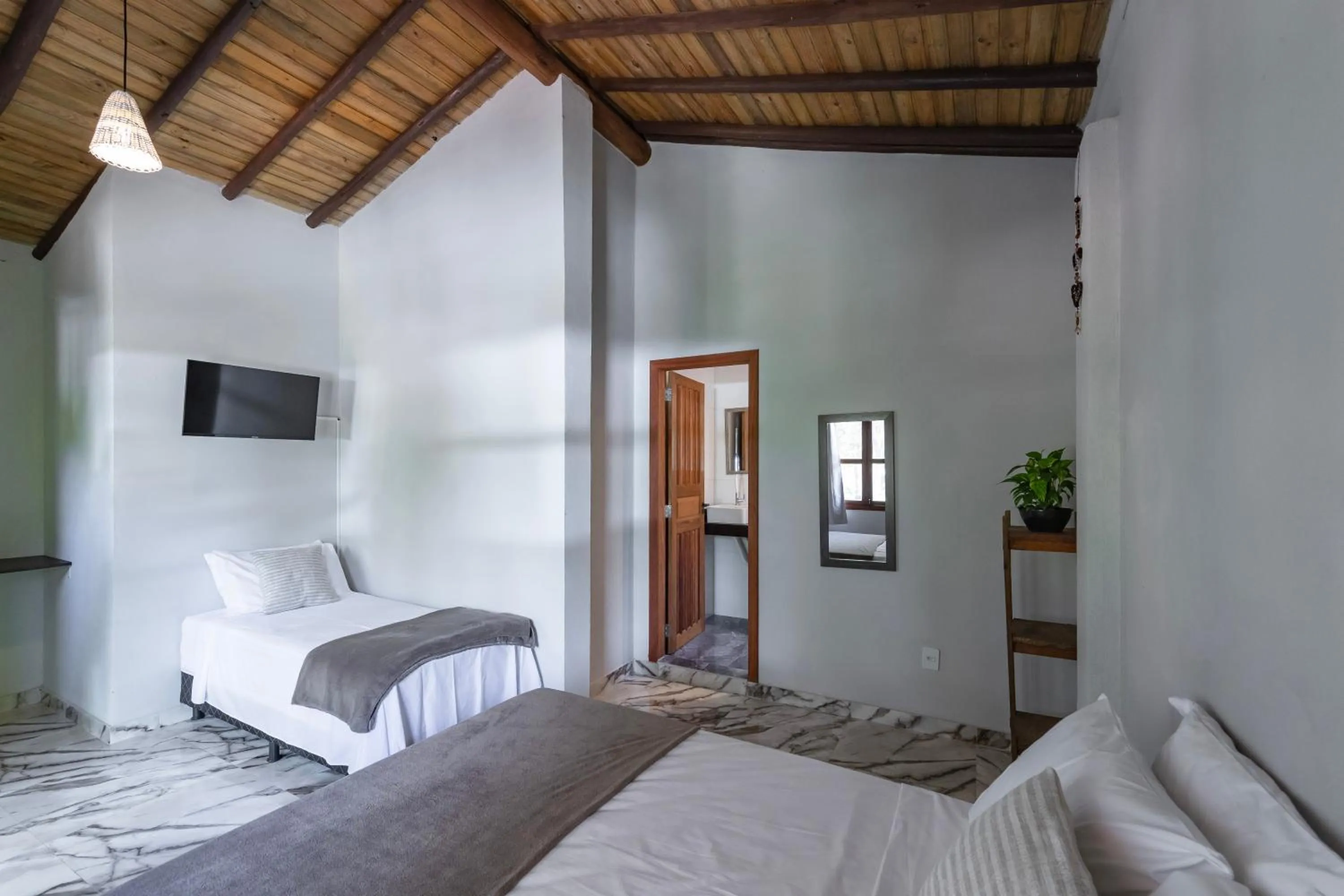 Bed in Pousada Arraial dos Sonhos