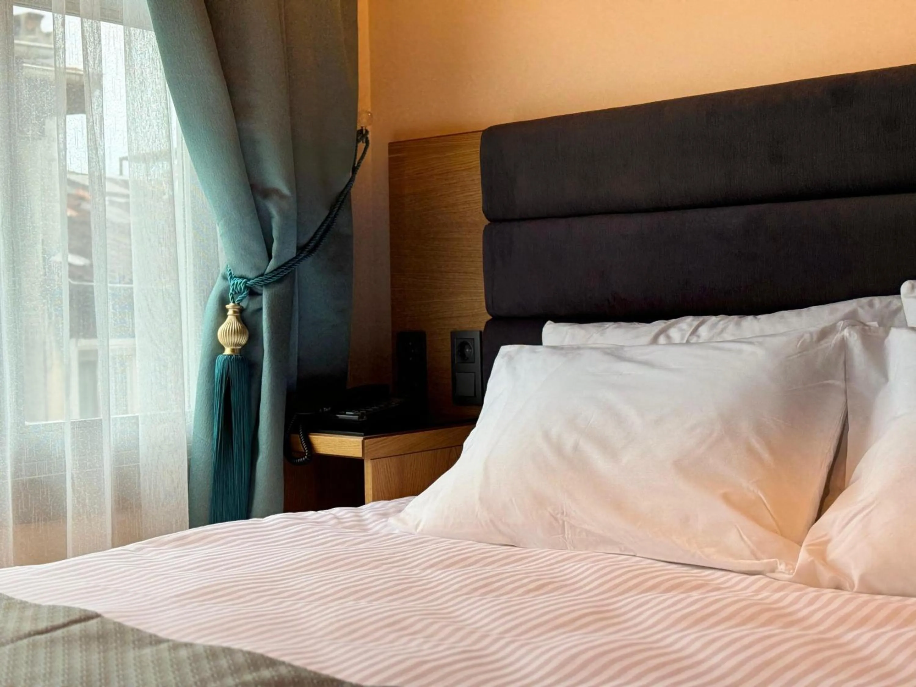 Bed in Abelia Mansion Hotel