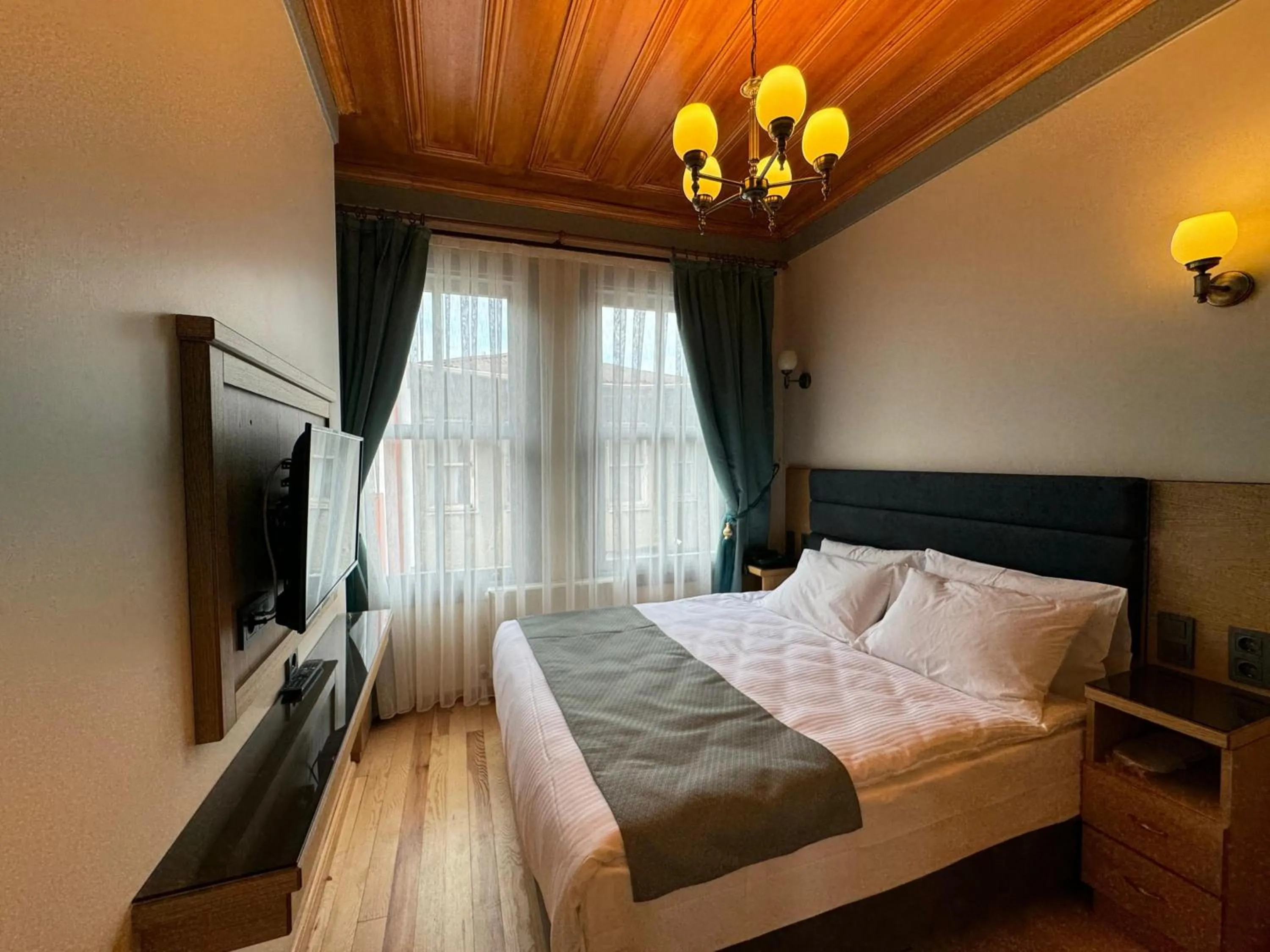 Bed in Abelia Mansion Hotel