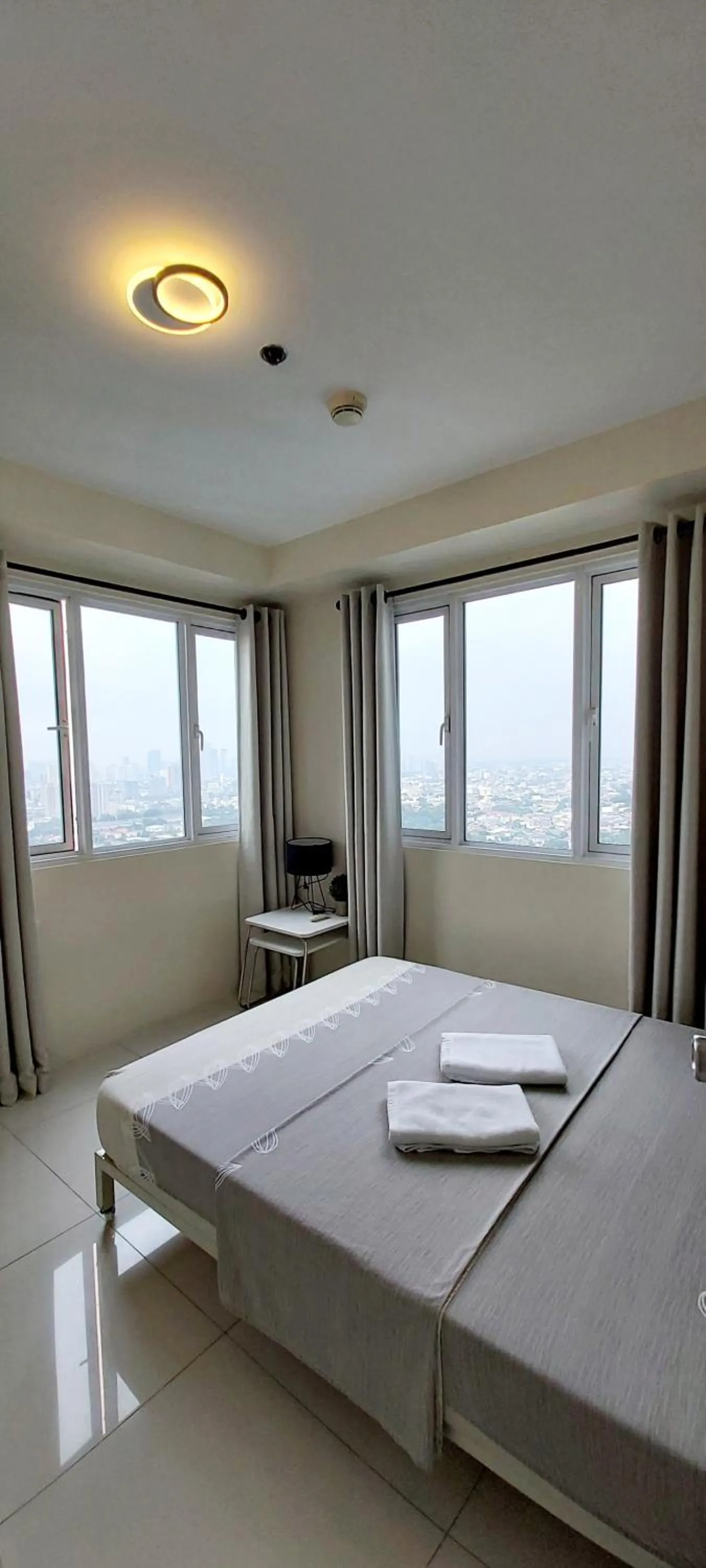 Bed in Condo Studio Luxe in Princeton Residences