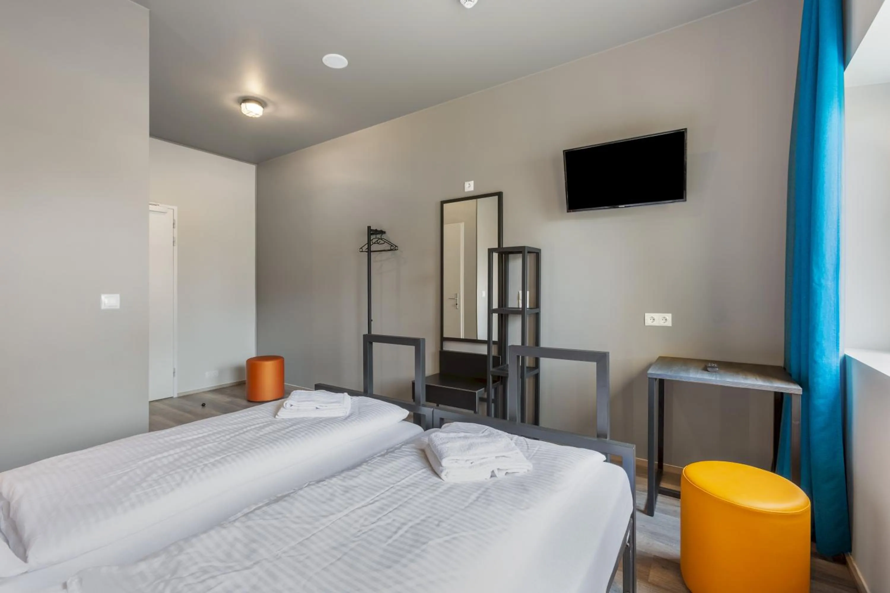 Photo of the whole room, TV/Entertainment Center in a&o Amsterdam Zuidoost