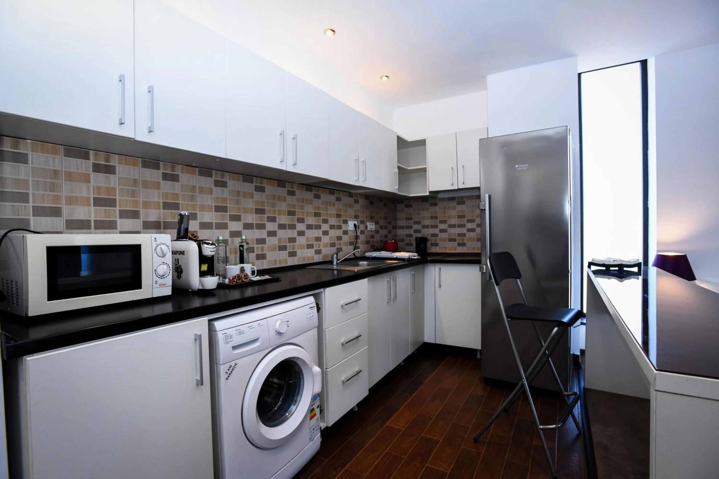 Kitchen or kitchenette in Uni88 Apart Hotel