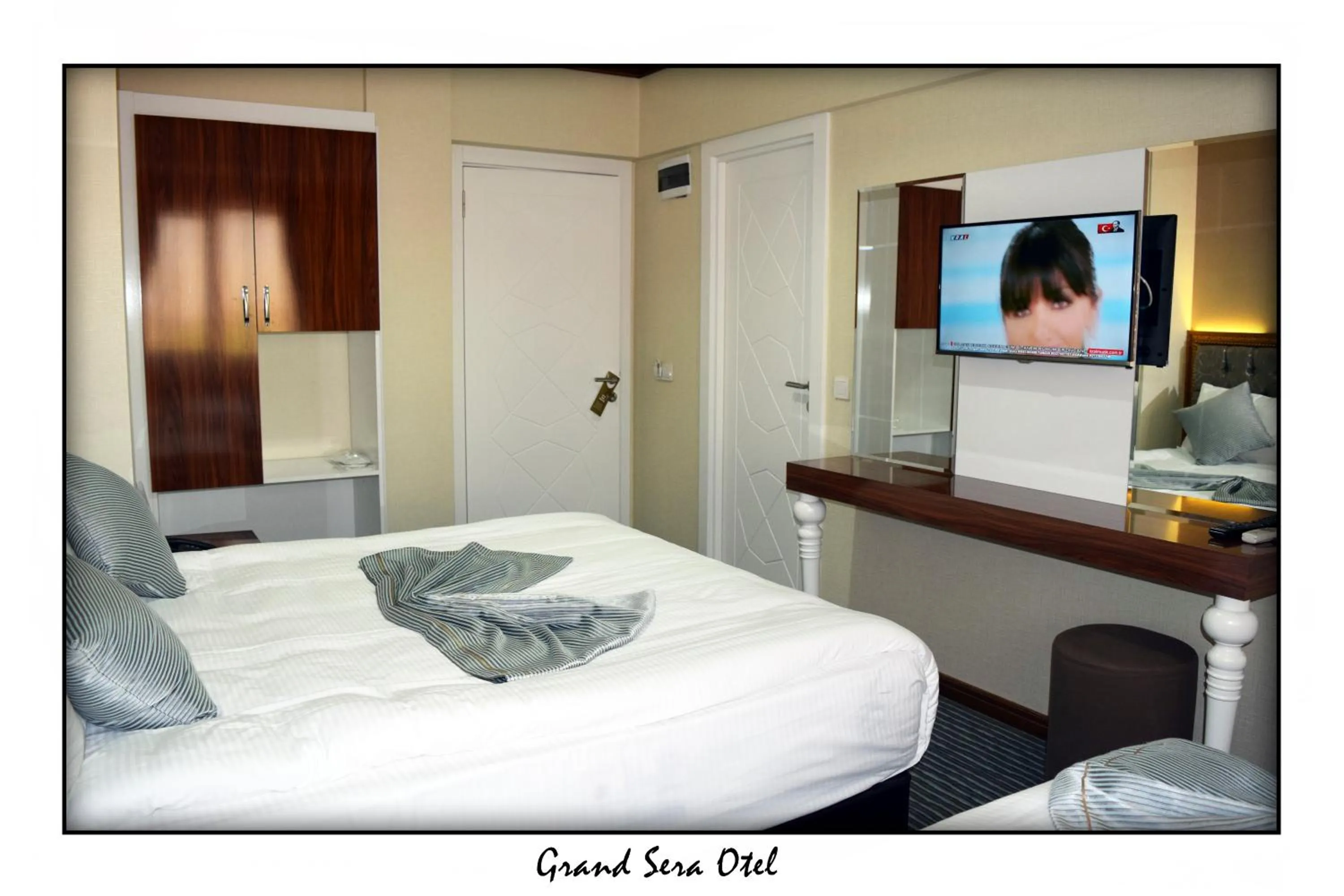 Text overlay, Bed in Grand Sera Hotel