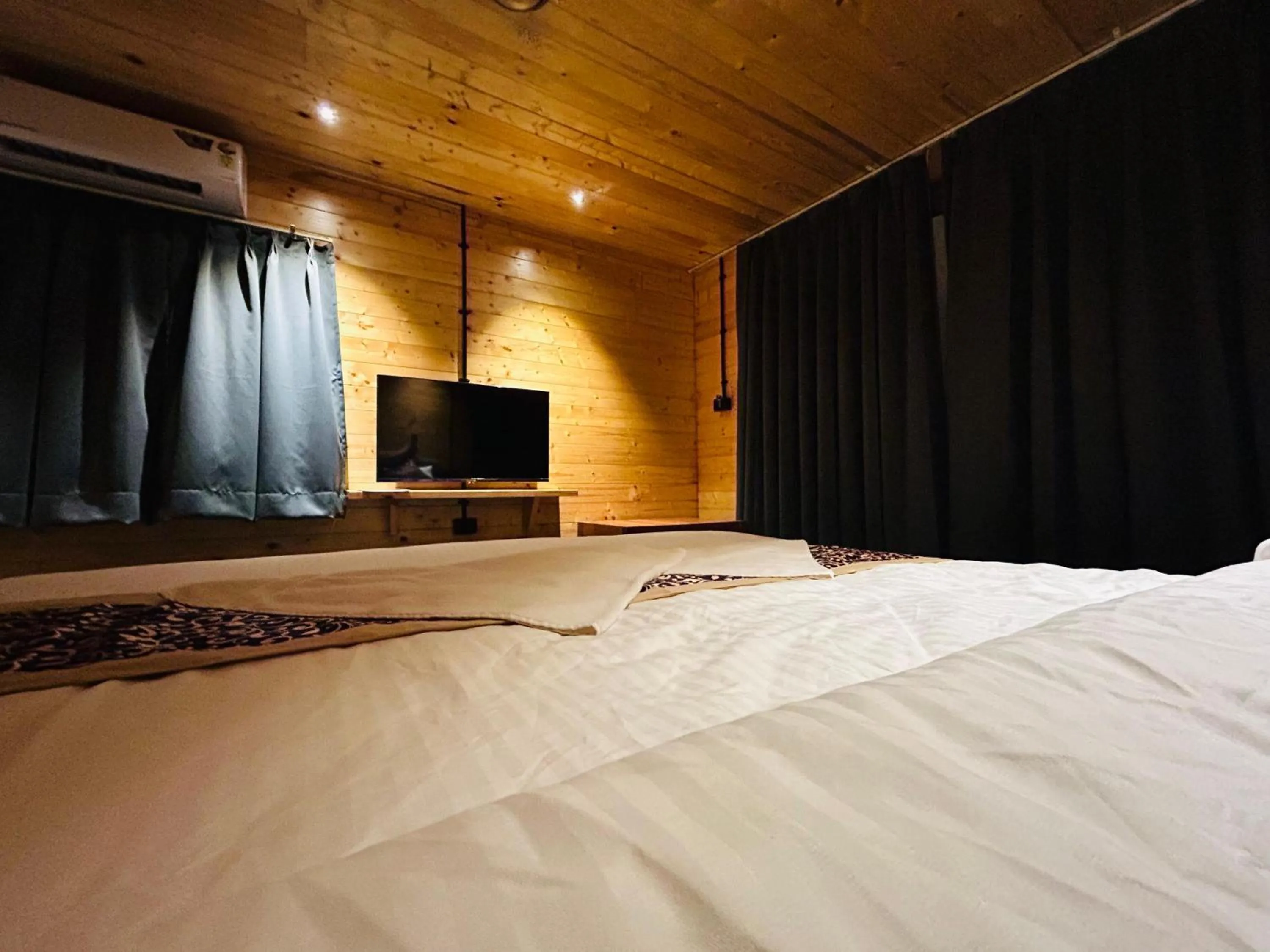 Bed in Seclude Eco Cottages