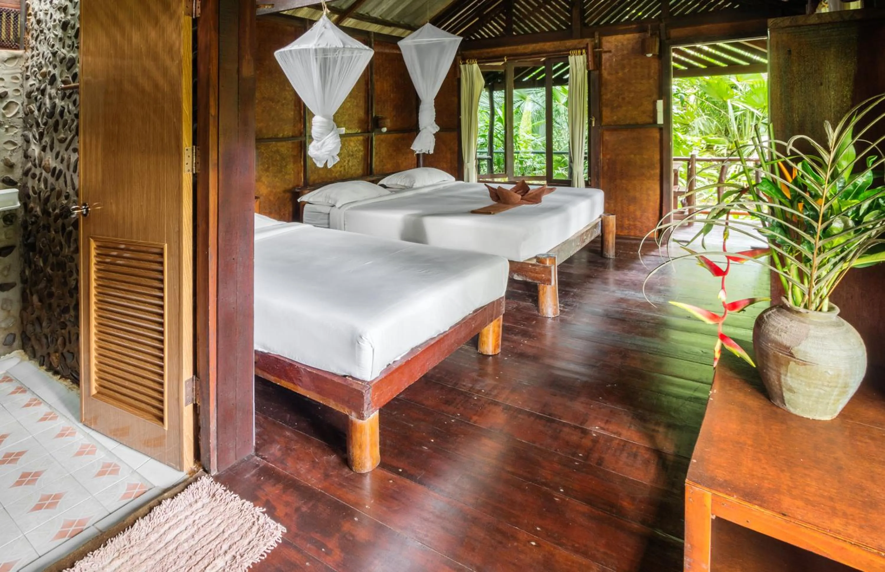 Bed in Khao Sok Riverside Cottages