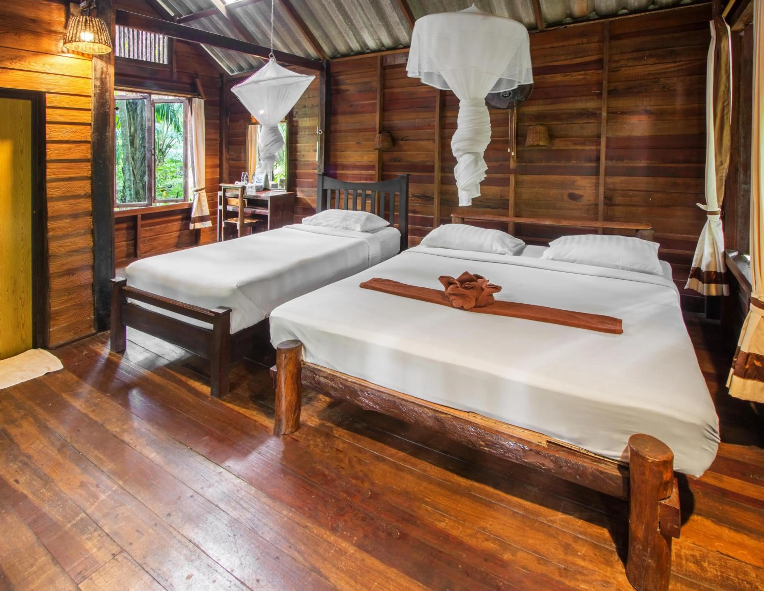 Bed in Khao Sok Riverside Cottages
