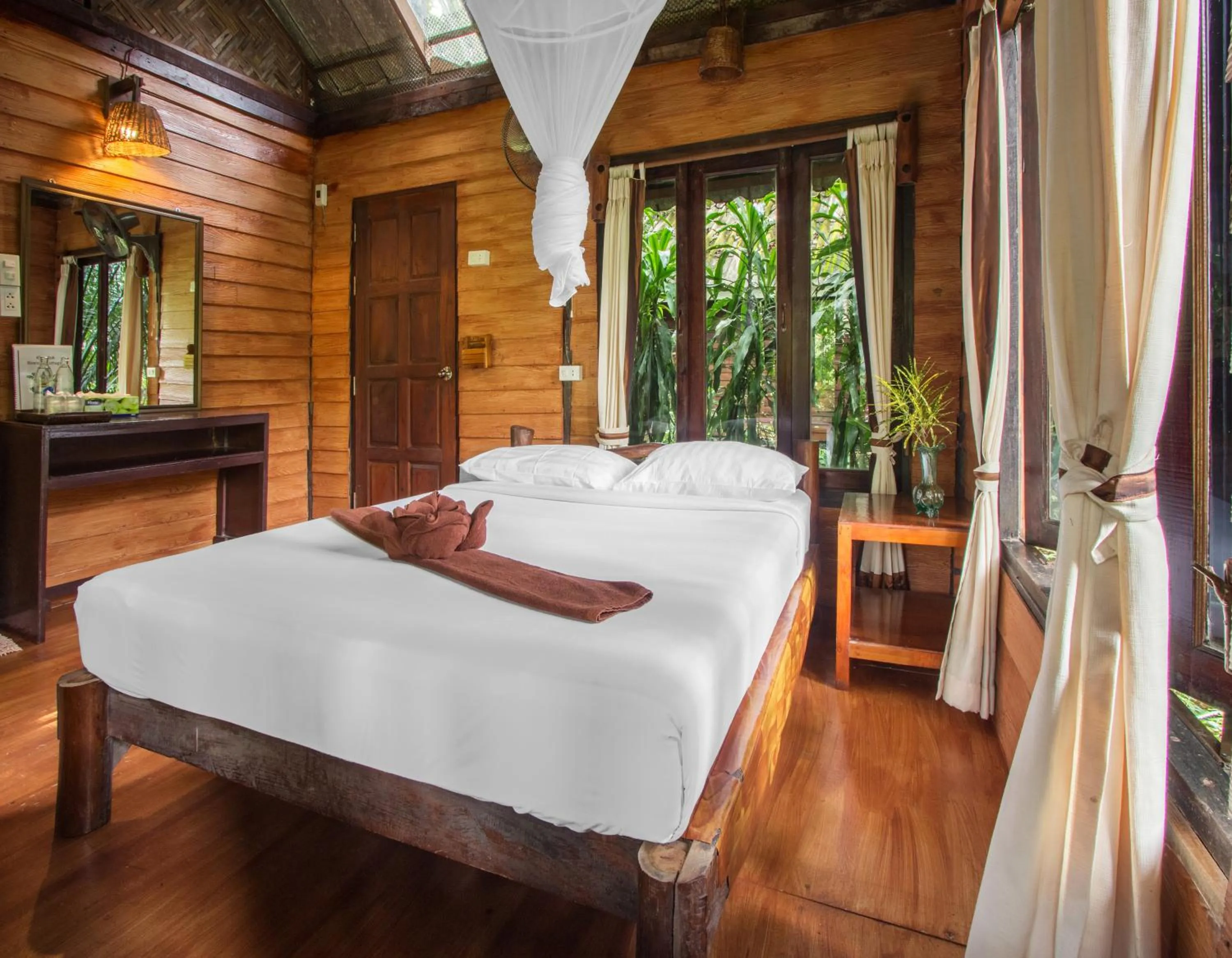 Bed in Khao Sok Riverside Cottages