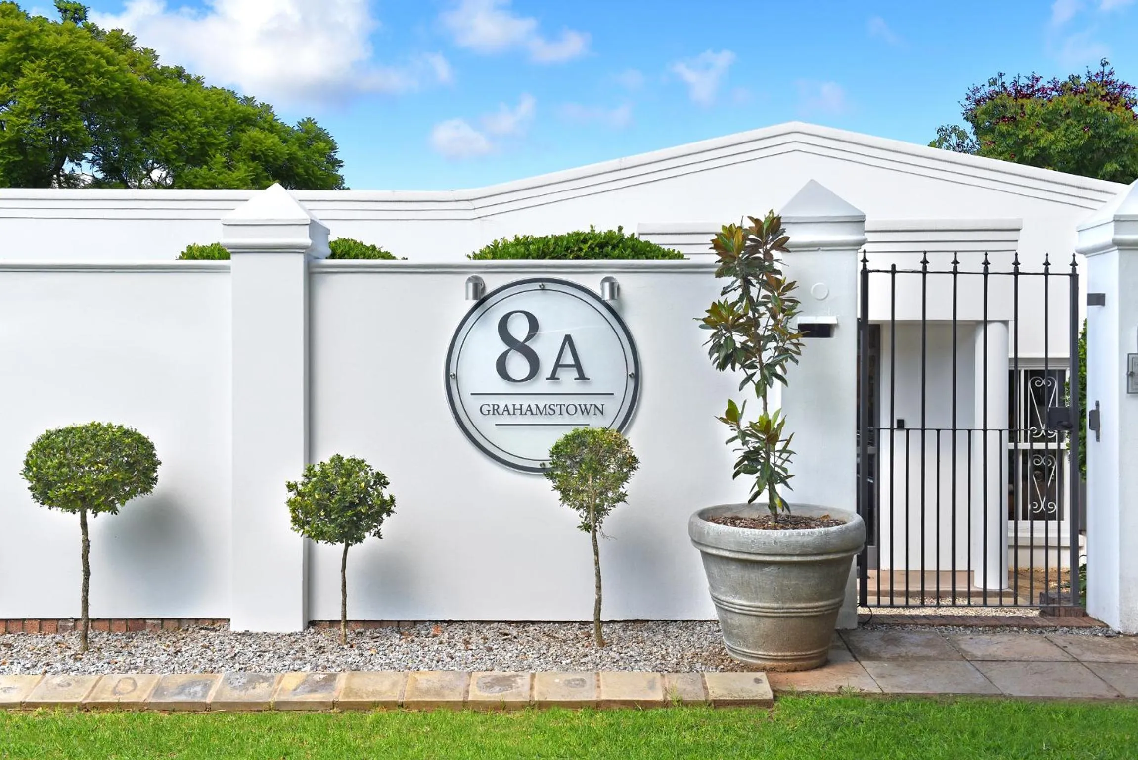 Facade/entrance in 8A Grahamstown by The Oyster Collection