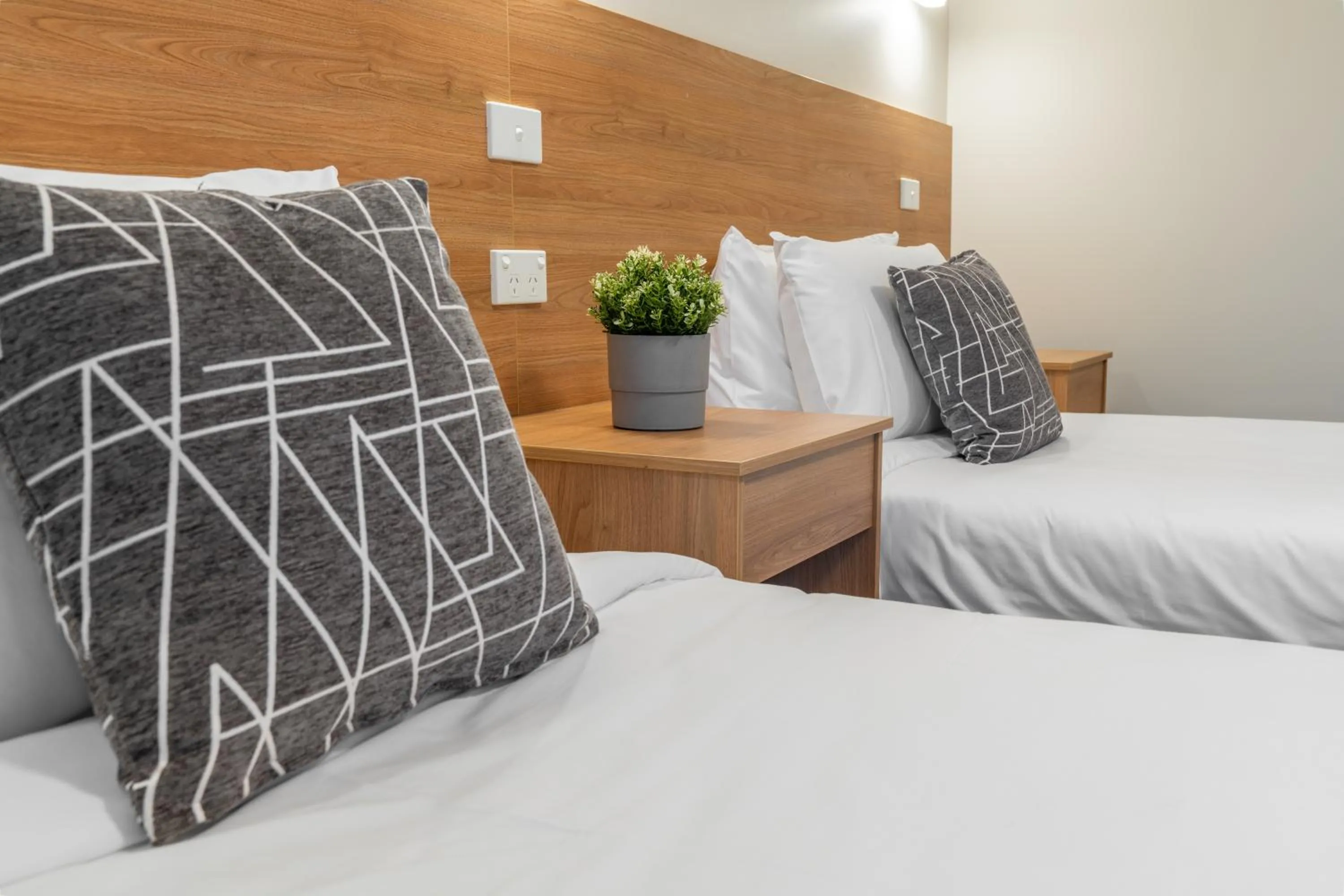 Bed in Rainbow Motel Queanbeyan