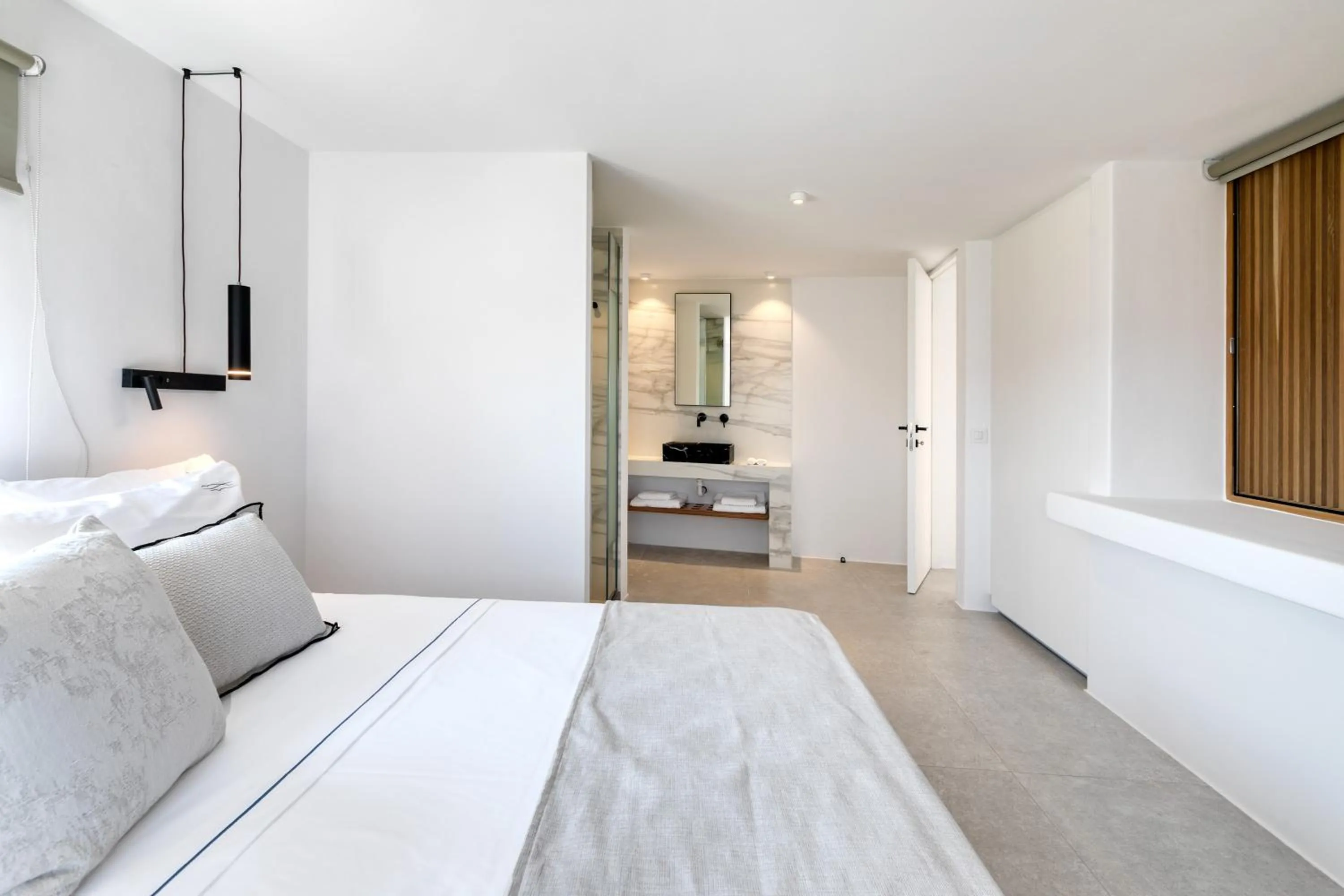 Bed in Nasta Suites & Villas Intentional Living Mykonos