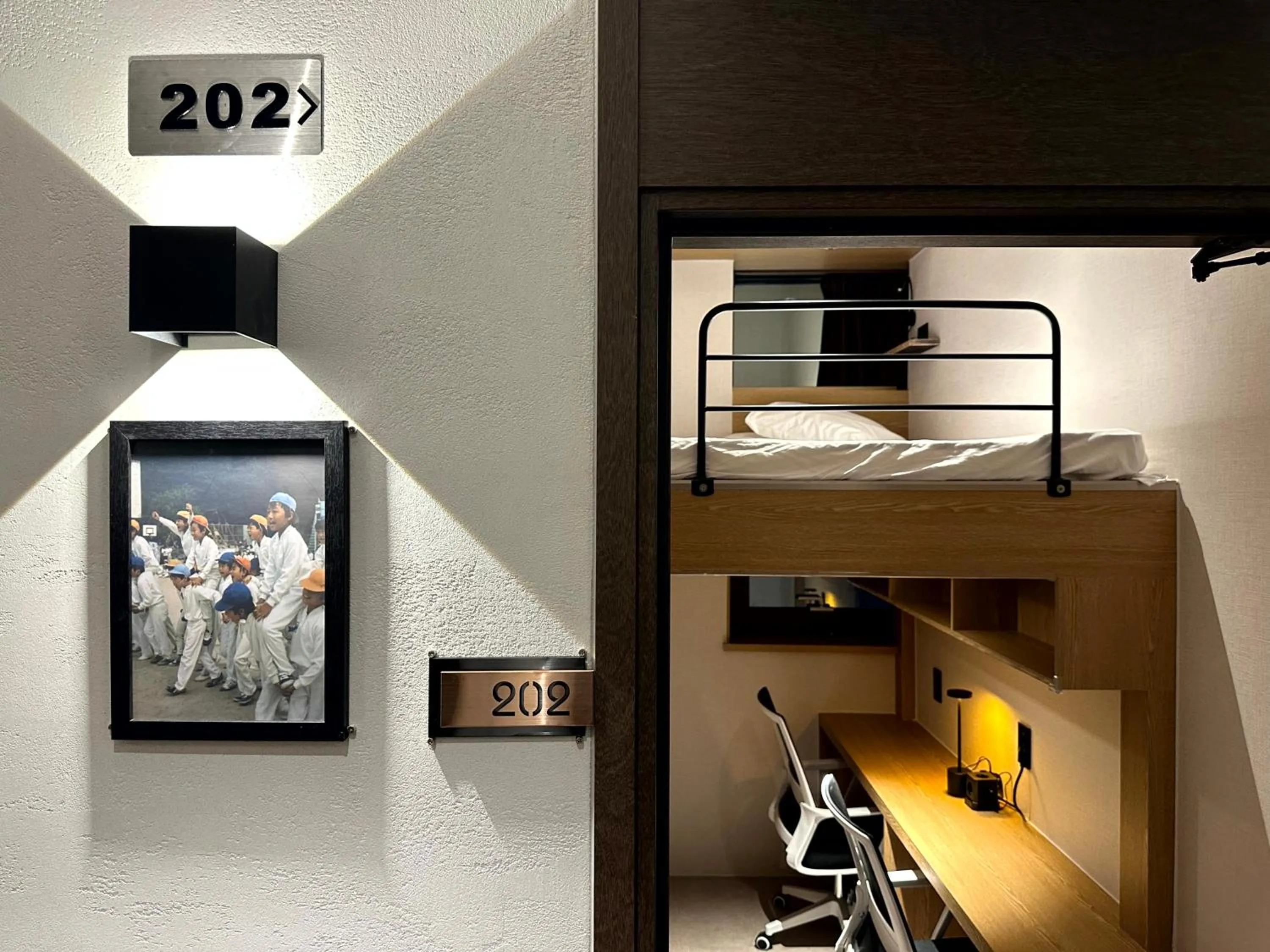 Seating area, Bed in Nomad Live Hostel