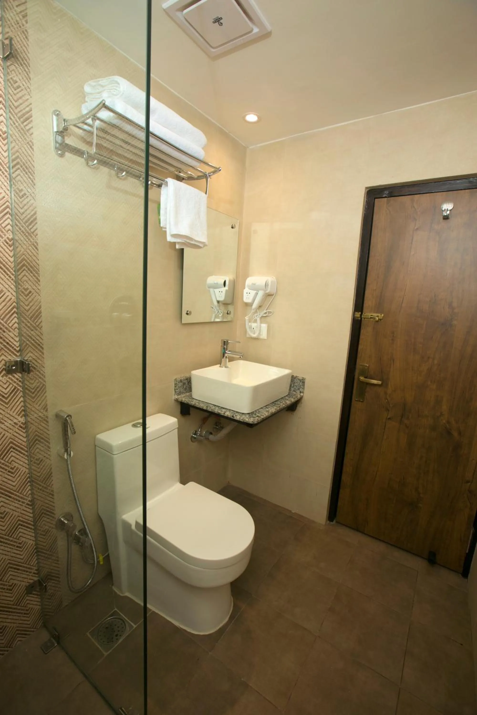 Toilet in Divya Boutique Inn