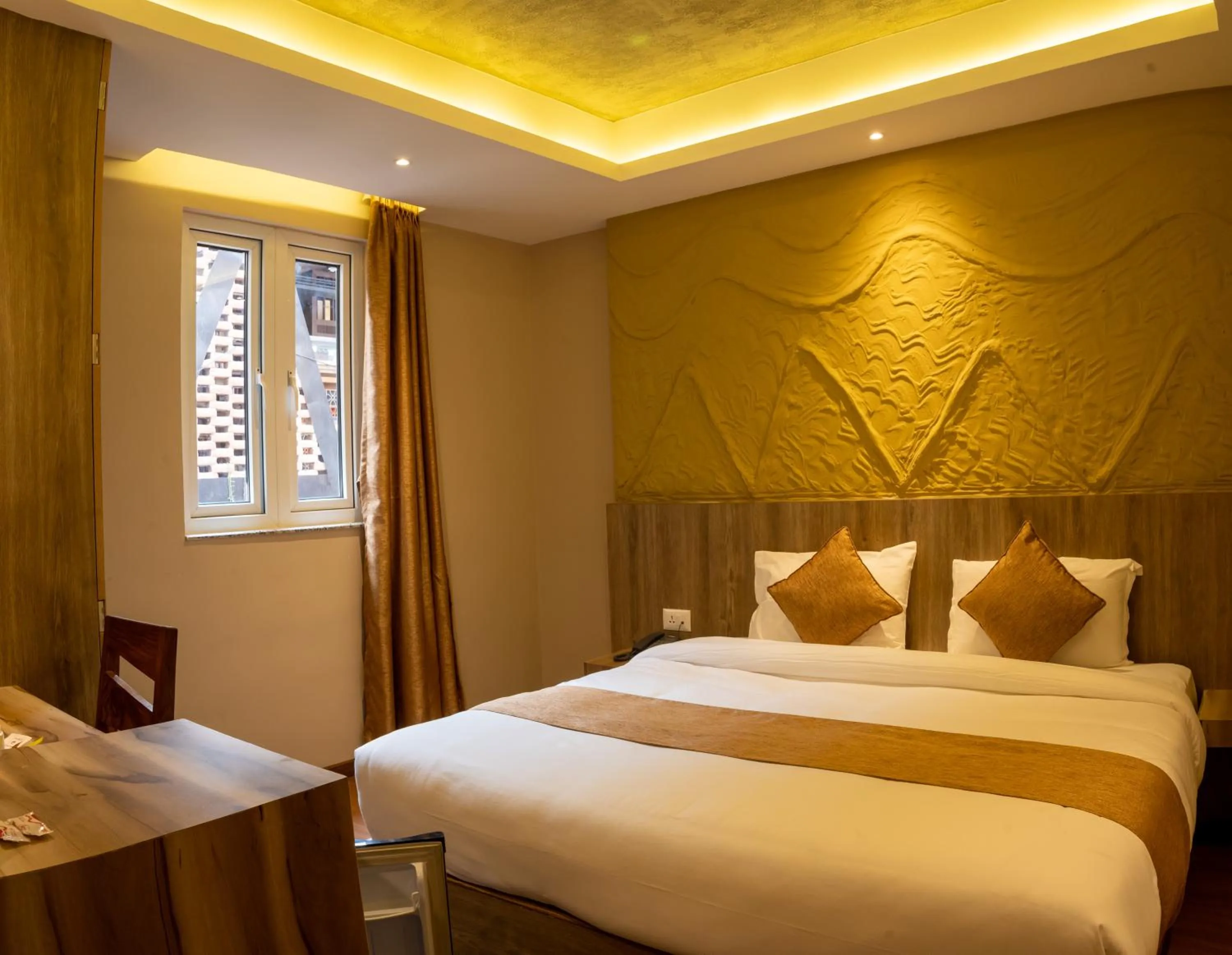 Bed in Divya Boutique Inn