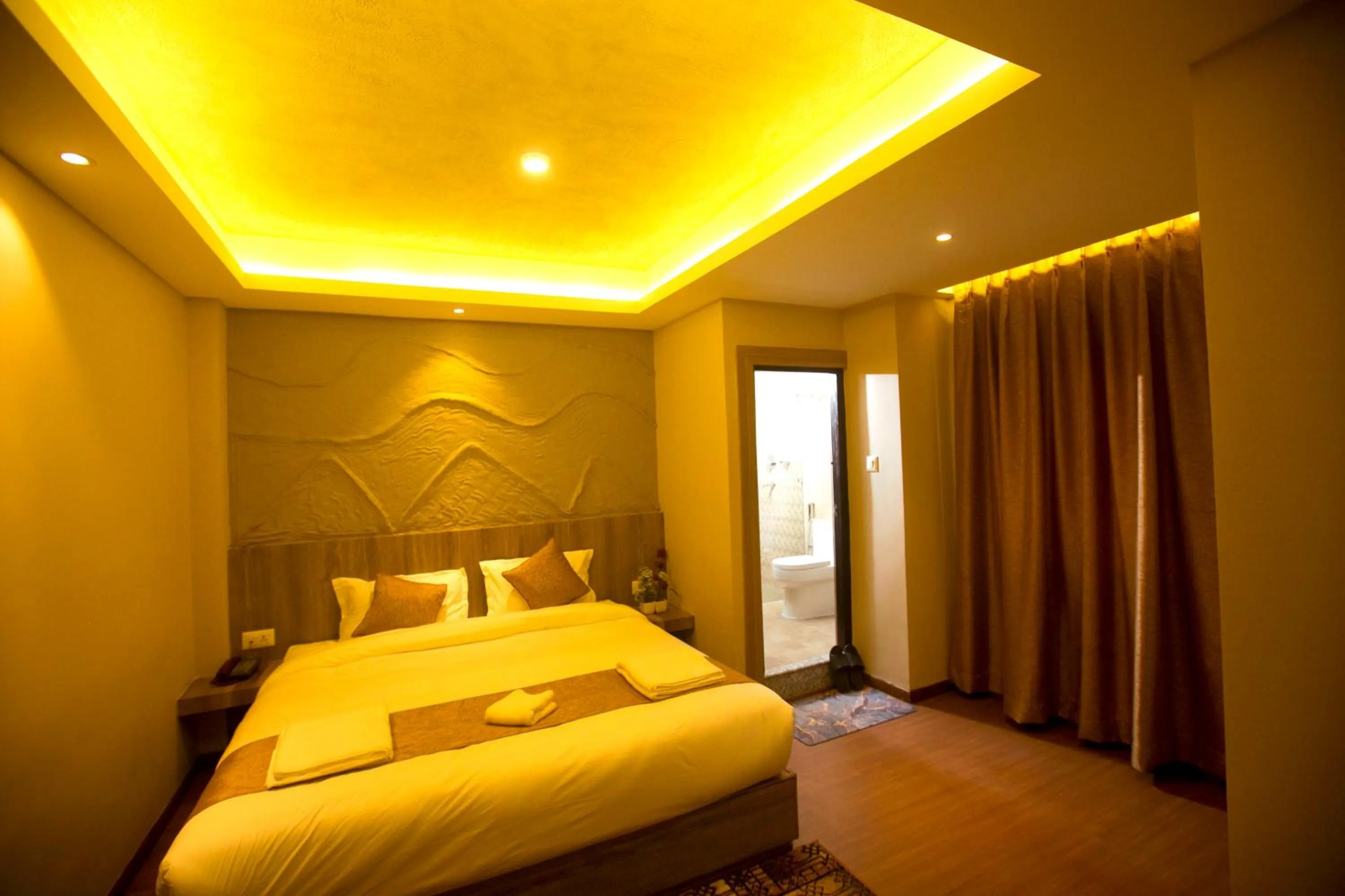 Bed in Divya Boutique Inn