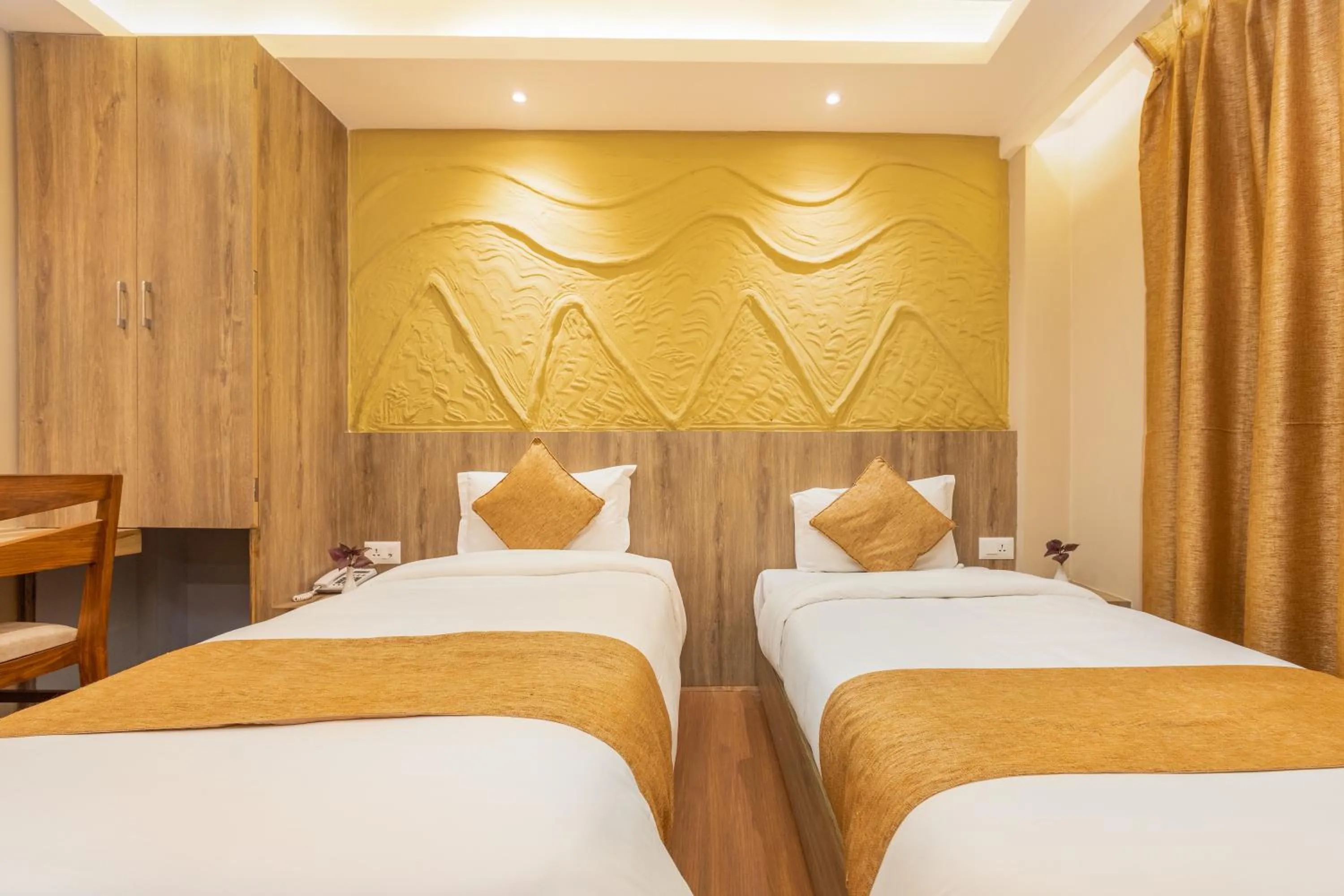 Bed in Divya Boutique Inn