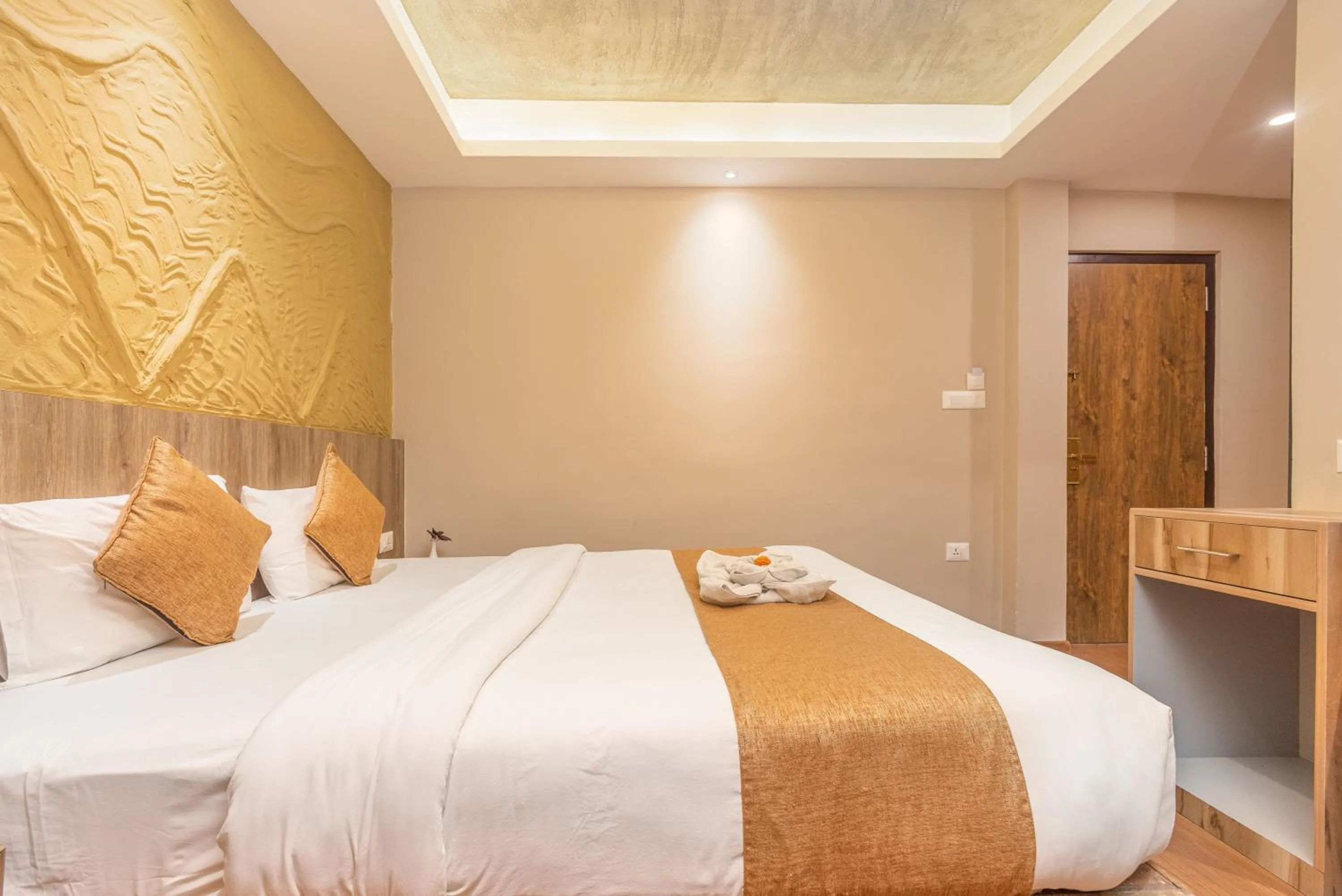 Bed in Divya Boutique Inn