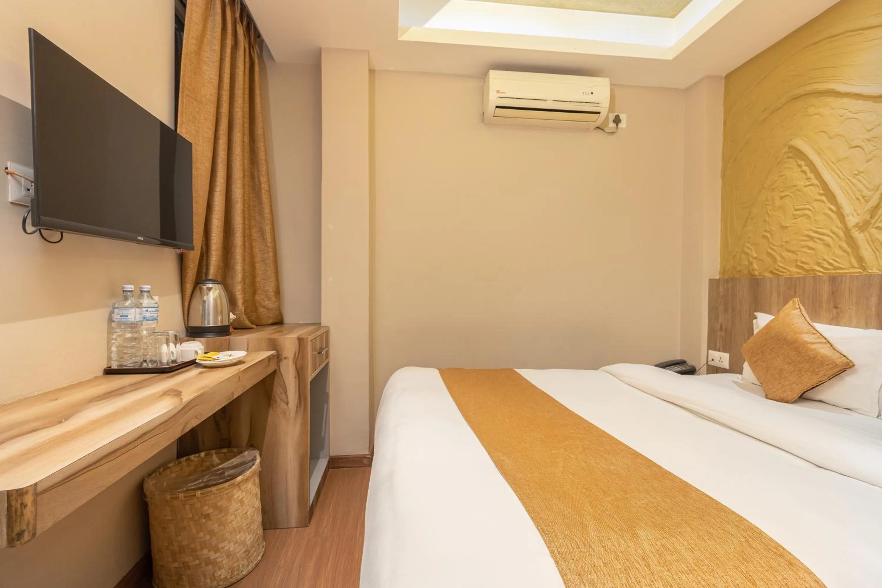 Bed in Divya Boutique Inn