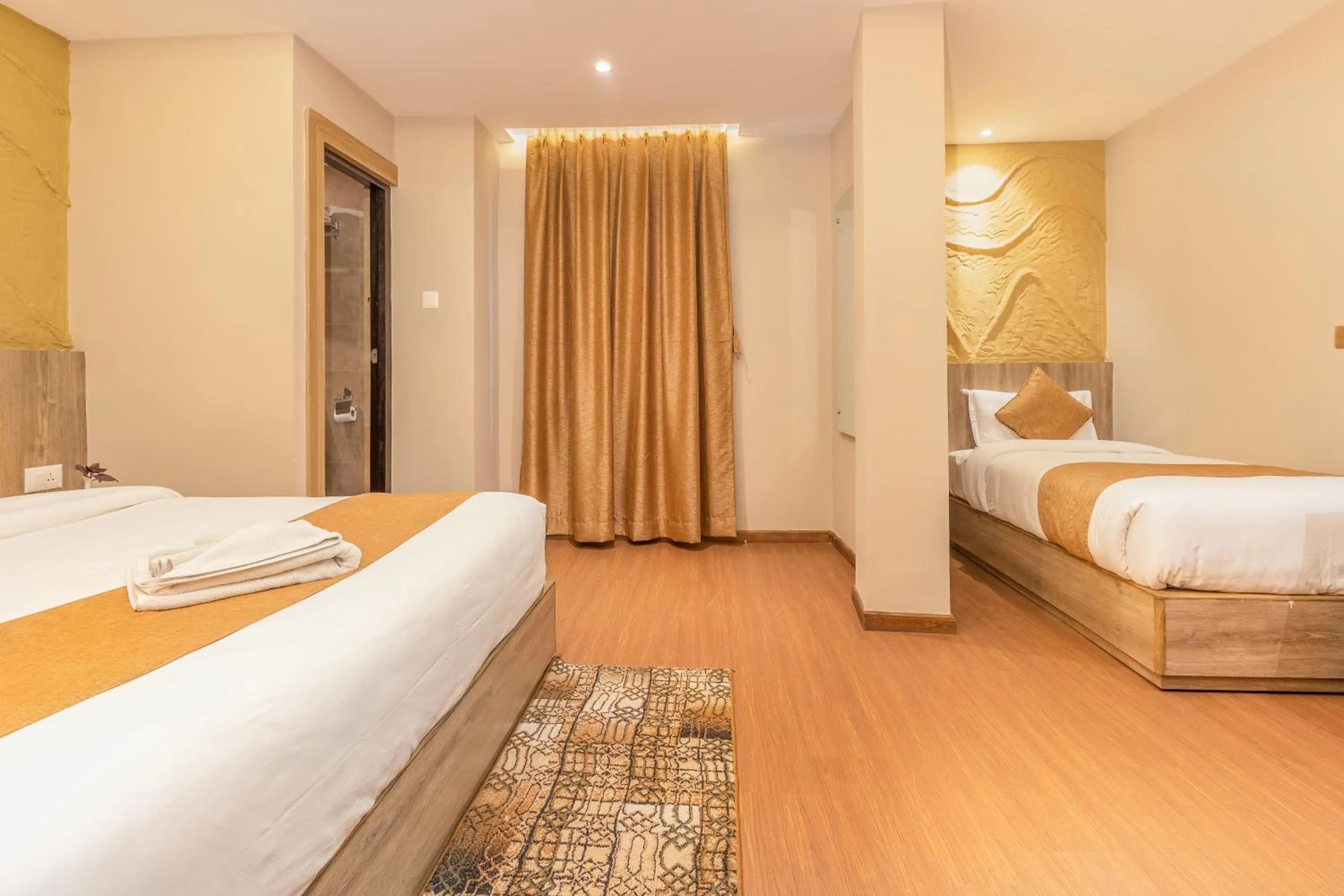 Bed in Divya Boutique Inn