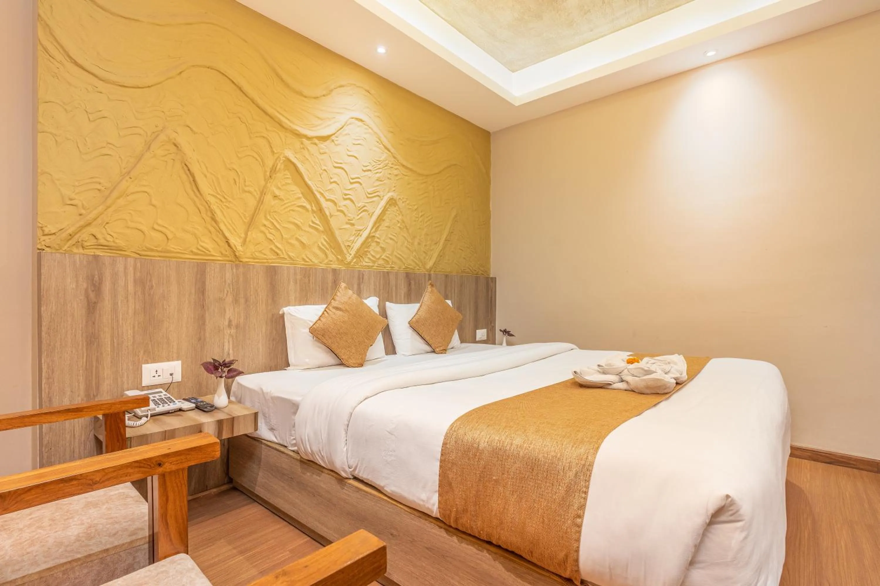 Bed in Divya Boutique Inn