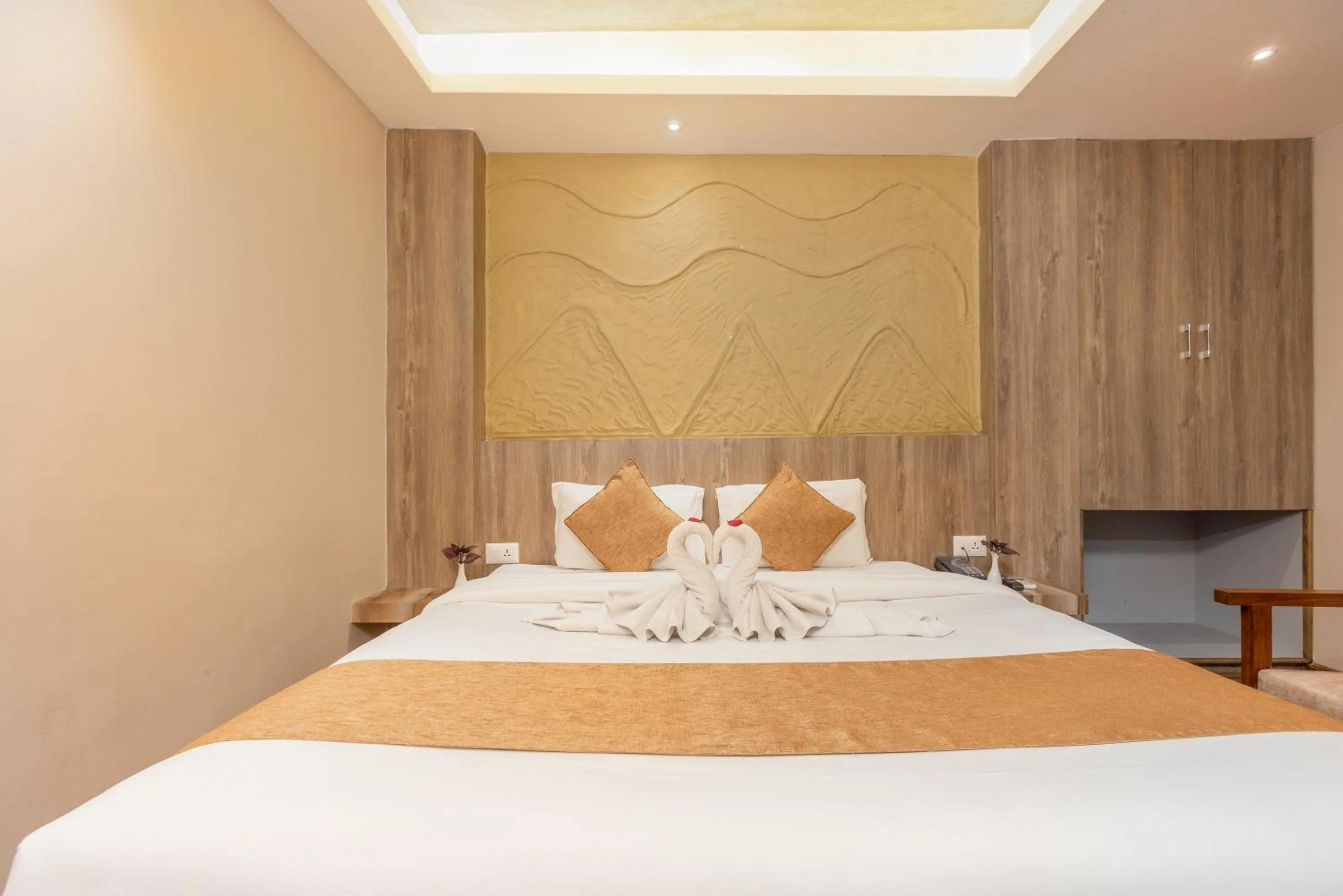 Bed in Divya Boutique Inn