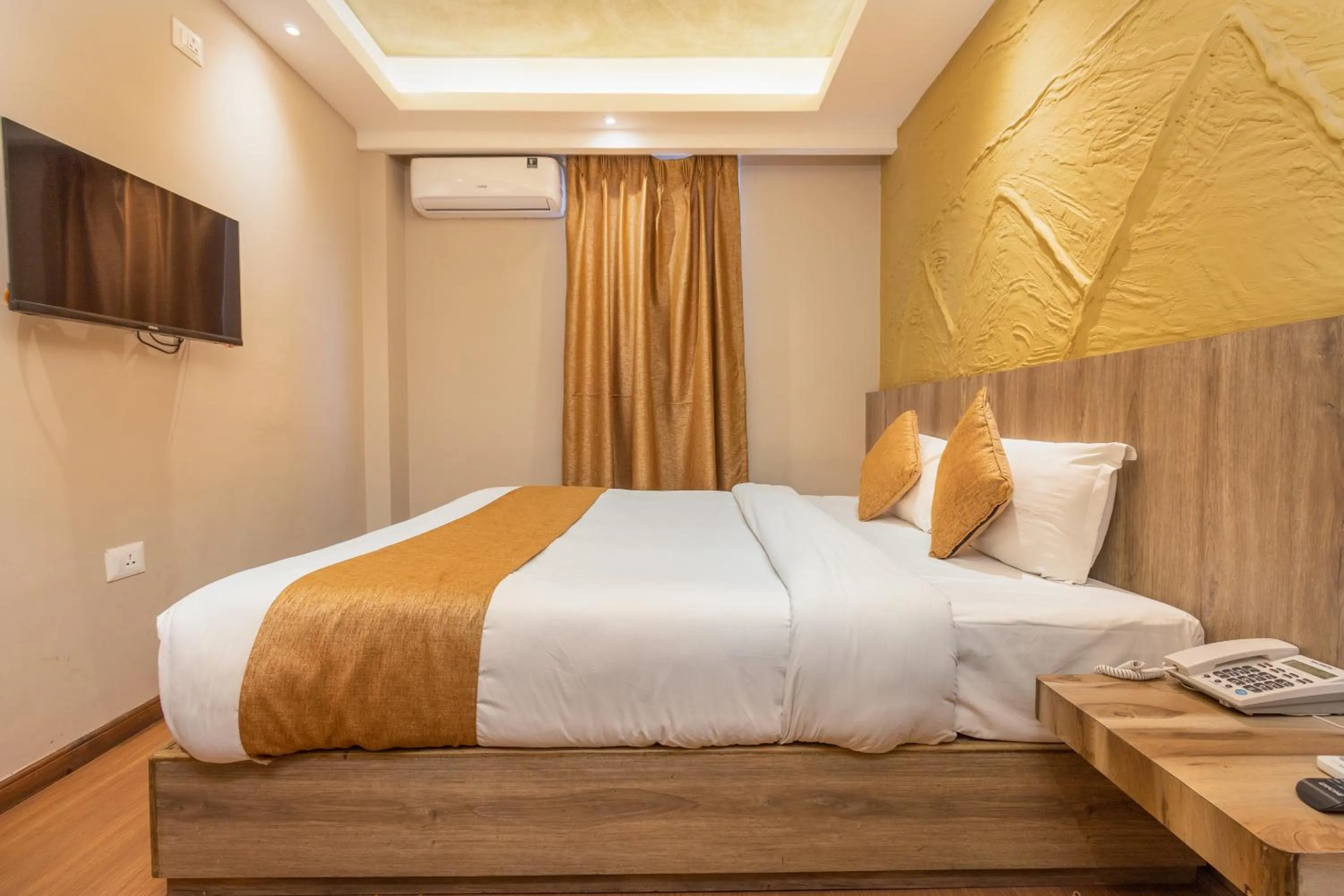 Bed in Divya Boutique Inn