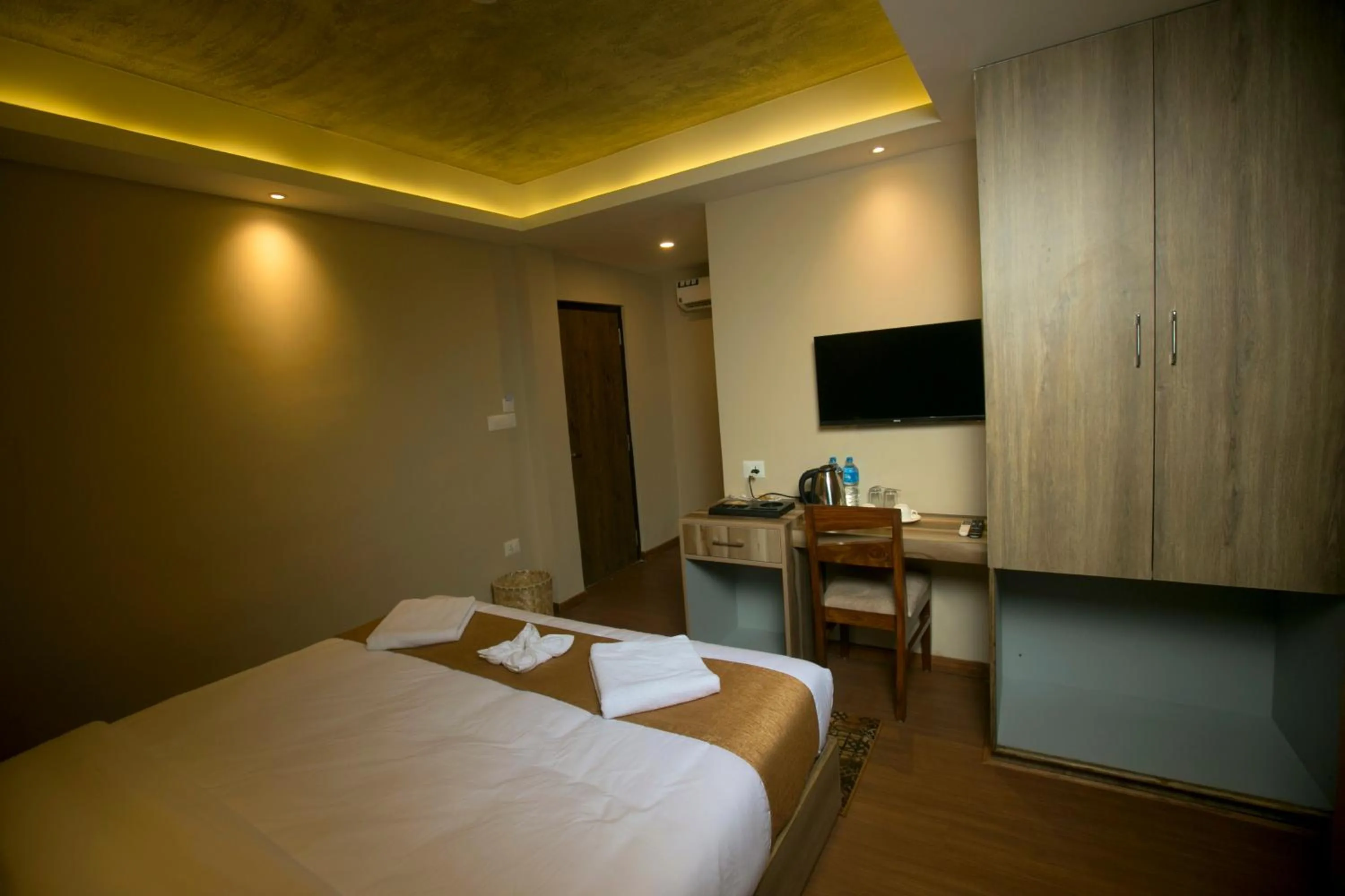 Bed in Divya Boutique Inn