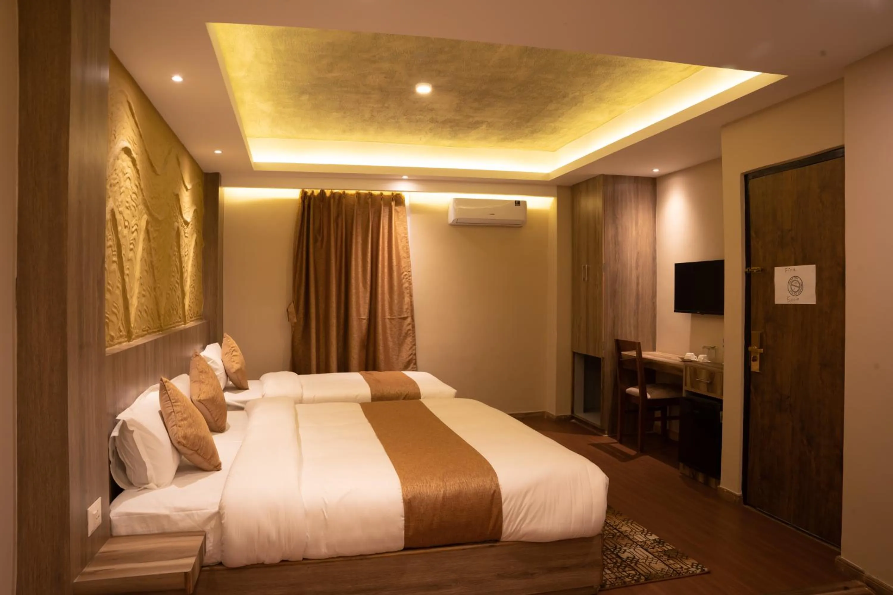 Bed in Divya Boutique Inn