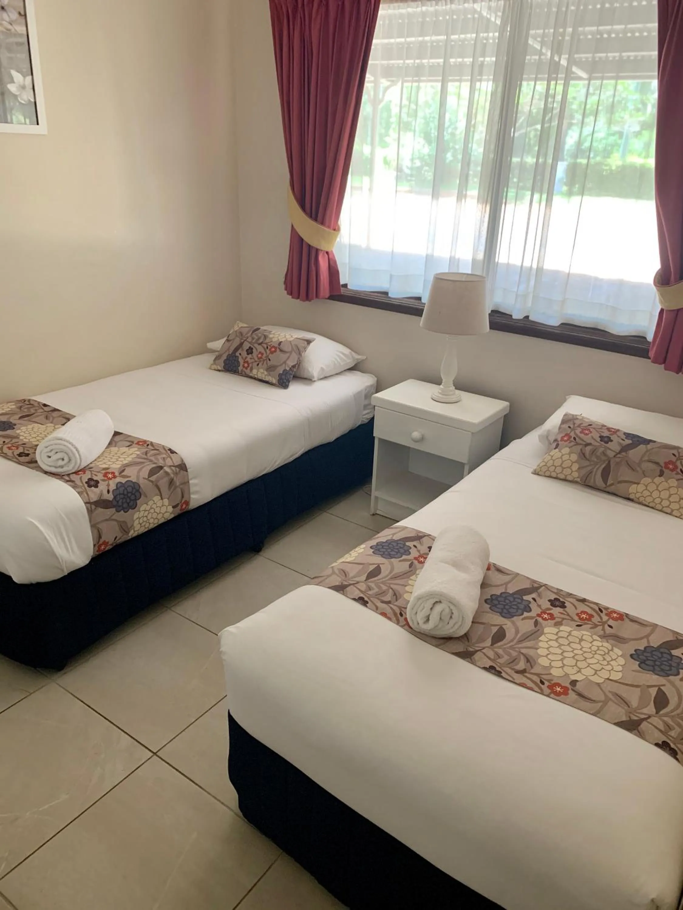 Bed in Montville Holiday Apartments