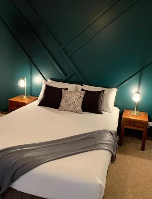 Bed in Montville Holiday Apartments