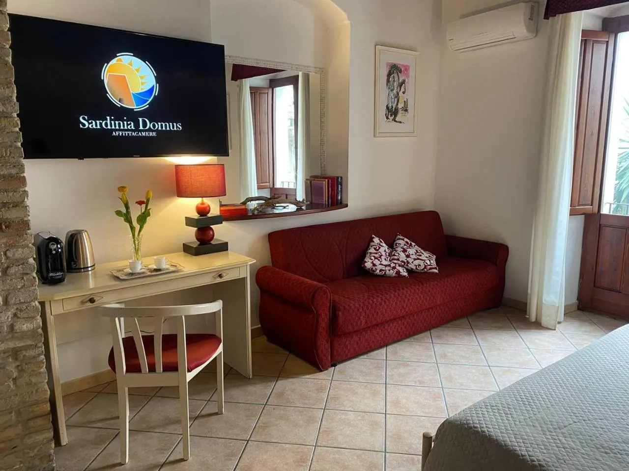 Photo of the whole room, Bed in Sardinia Domus