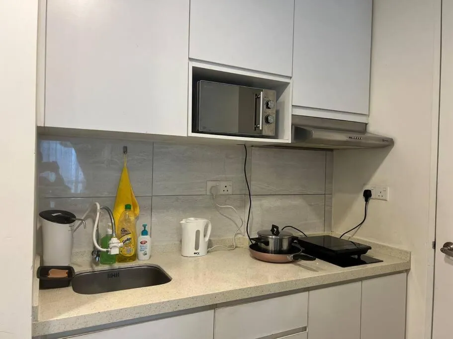 Kitchen or kitchenette in The Robertson Bukit Bintang by DeUrban