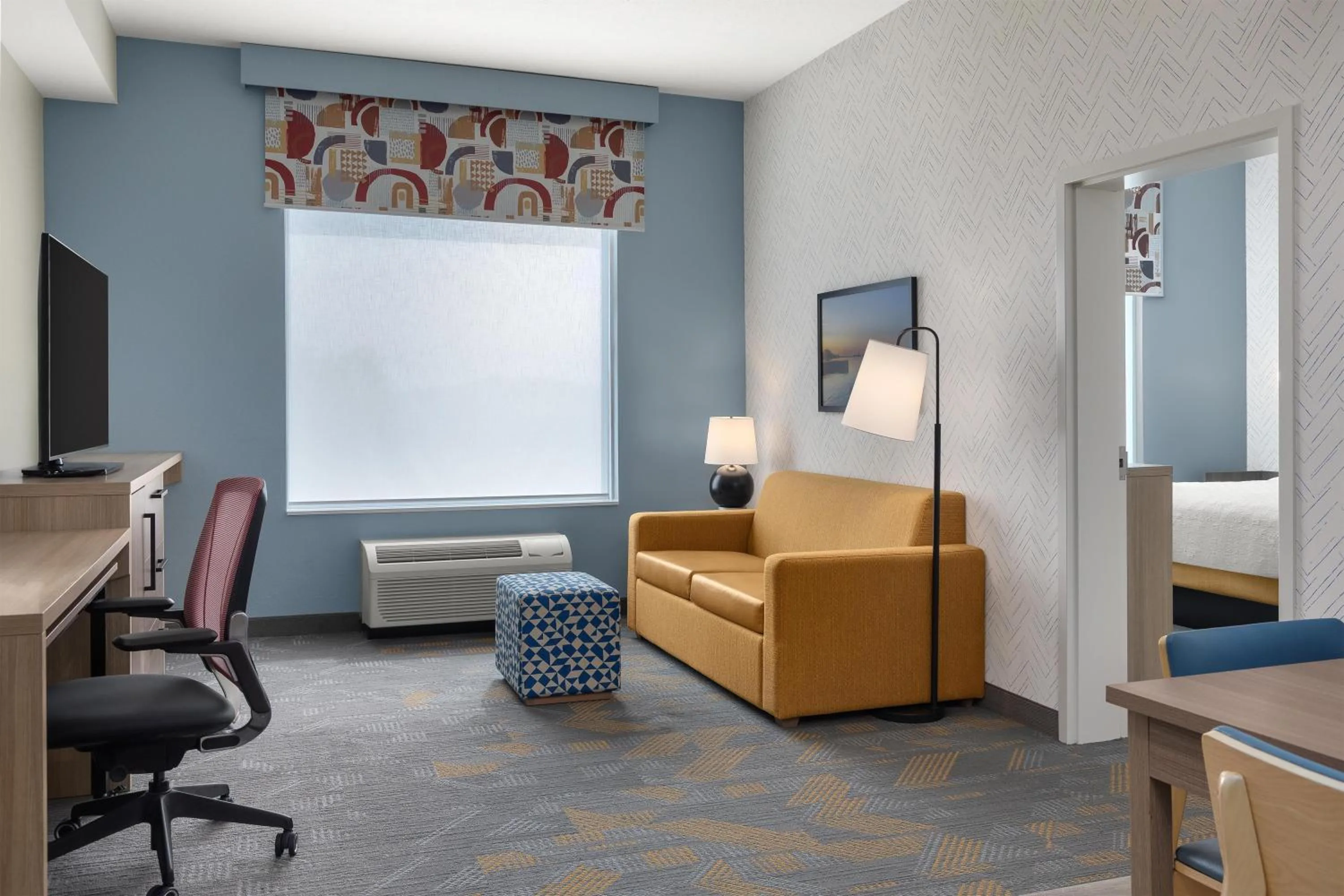 Living room, Bed in Home2 Suites By Hilton Woodstock On