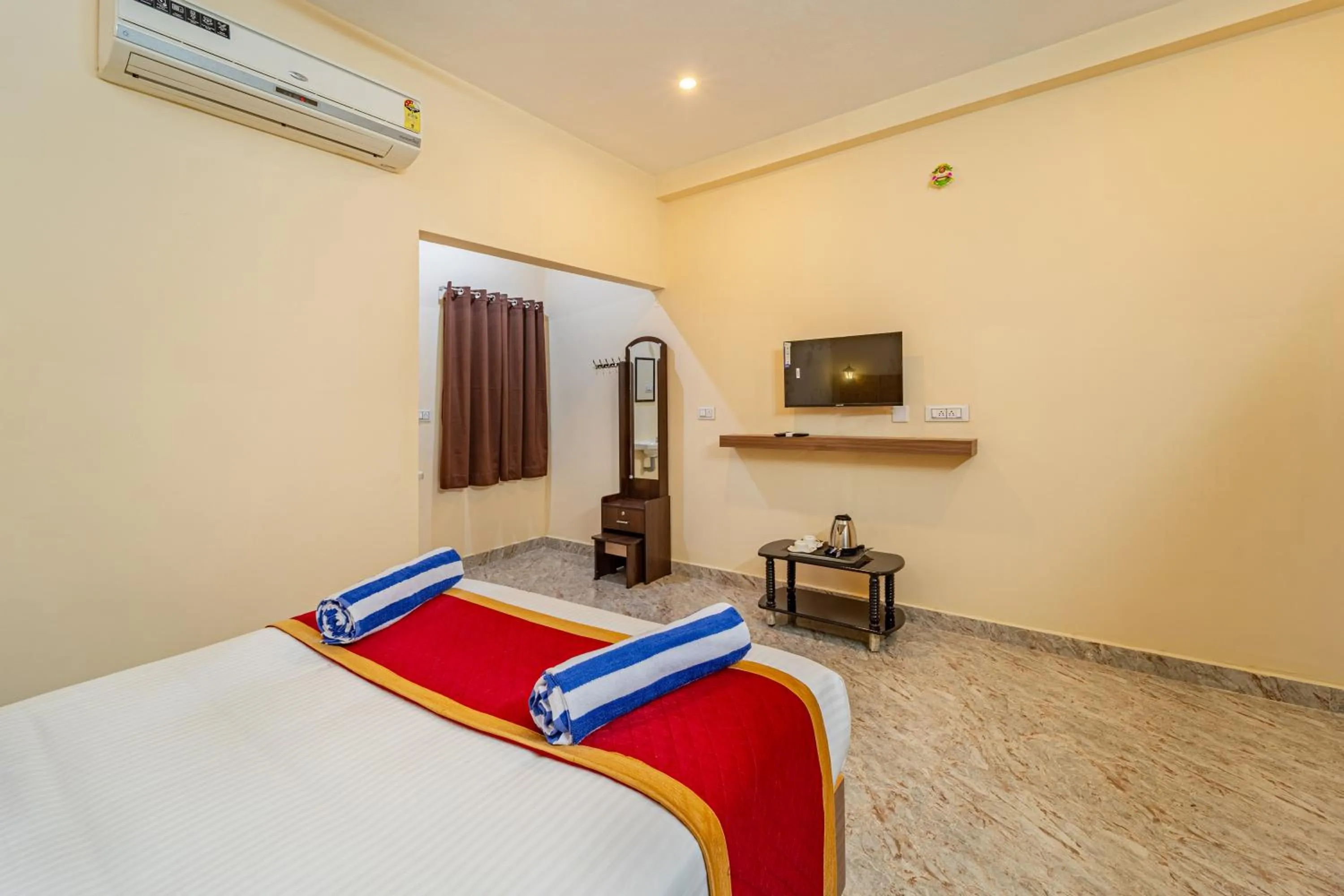 air conditioner, Bed in Hotel De Jardin Pondicherry with Swimming Pool