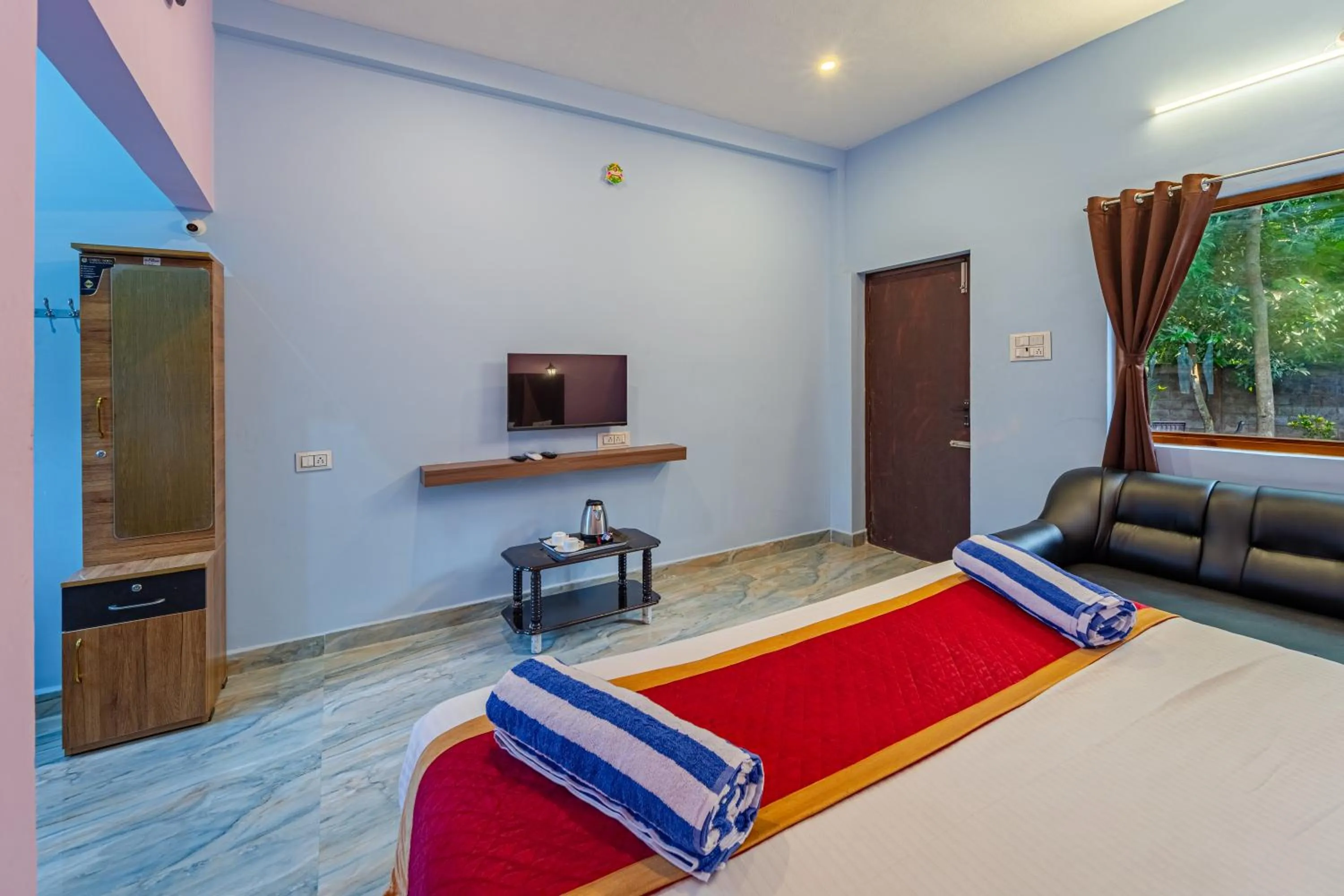 Bed in Hotel De Jardin Pondicherry with Swimming Pool