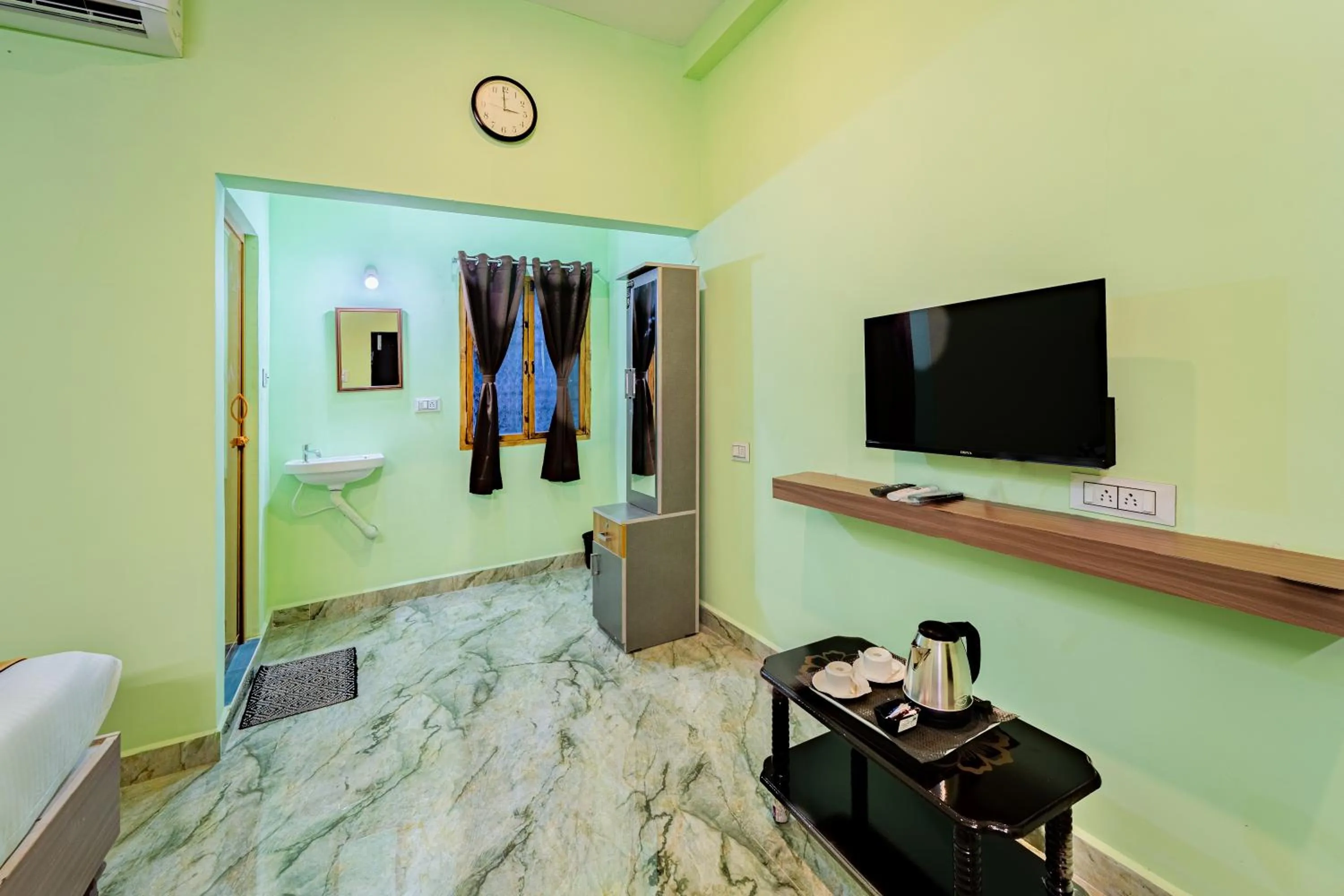 Bedroom in Hotel De Jardin Pondicherry with Swimming Pool