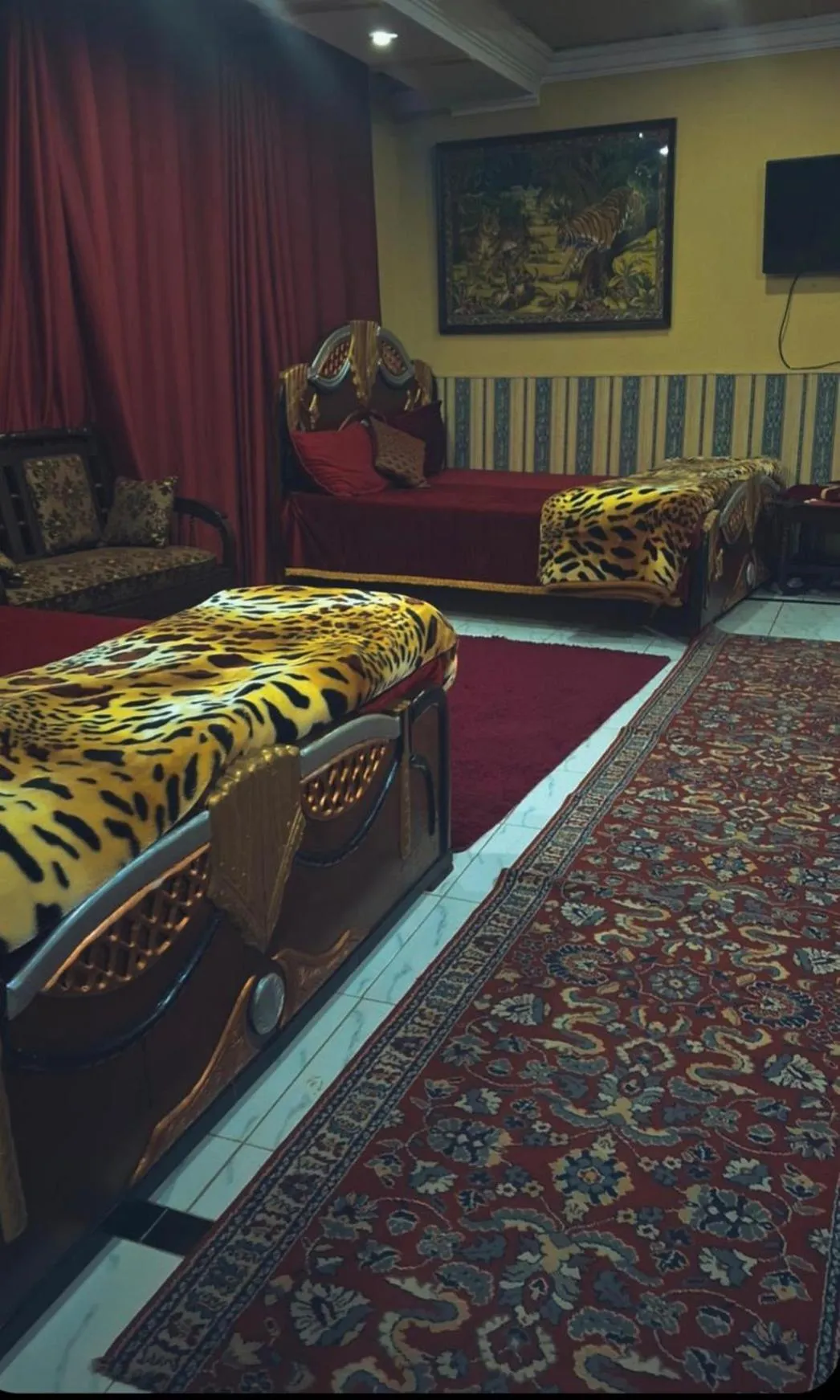 Communal lounge/ TV room, Bed in AK Hotel Abbottabad