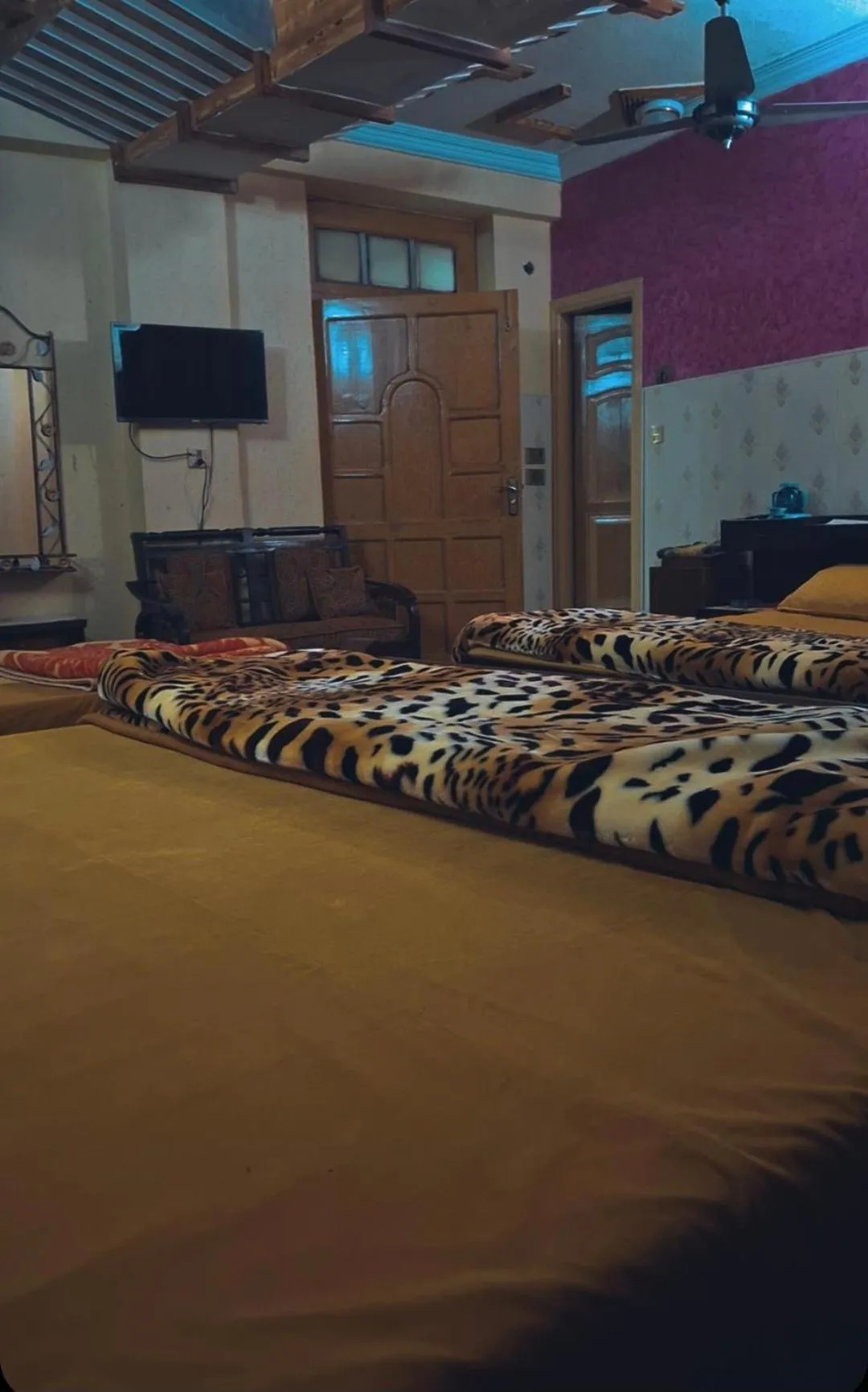 Communal lounge/ TV room, Bed in AK Hotel Abbottabad