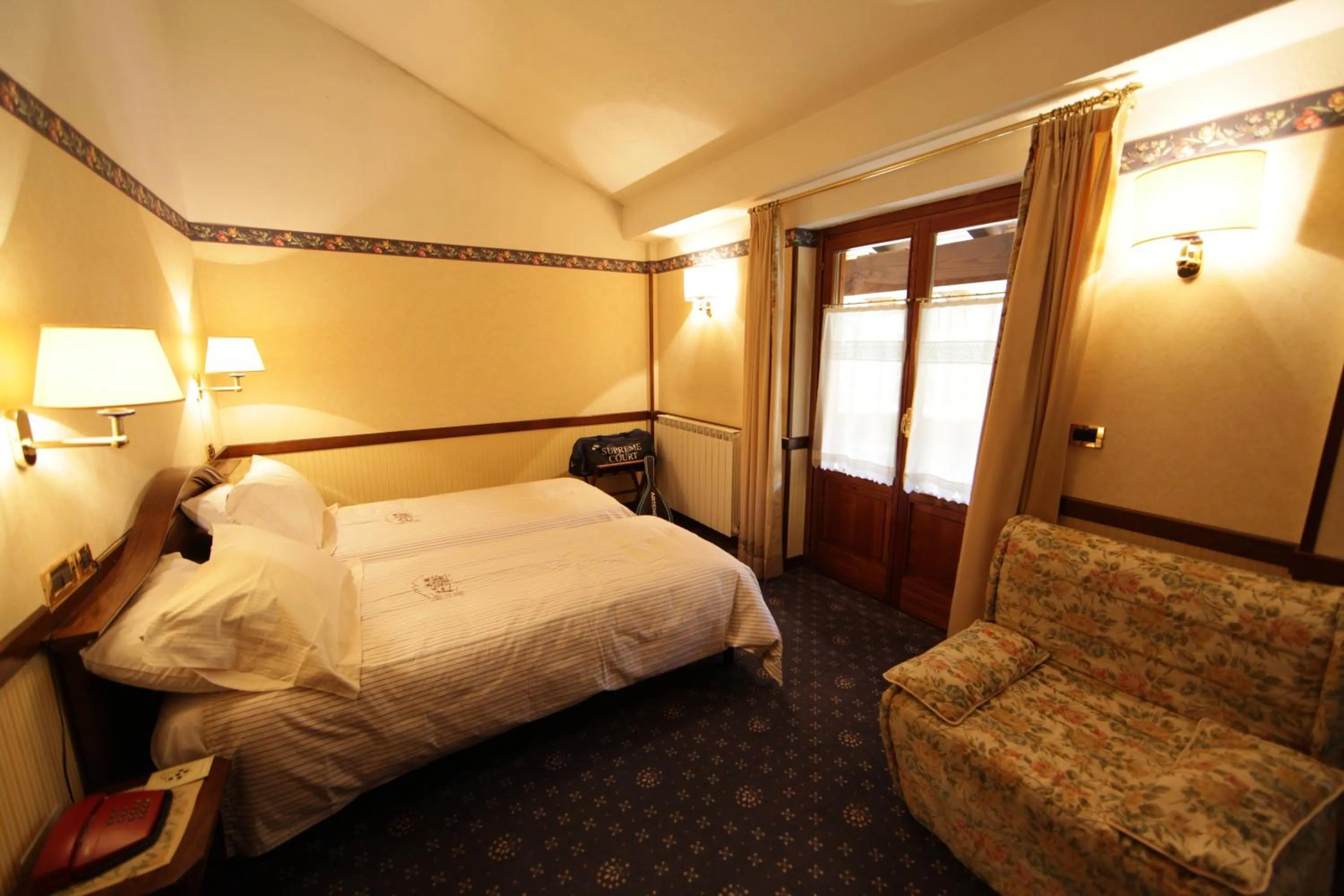 Bed in Hotel Petit Prince