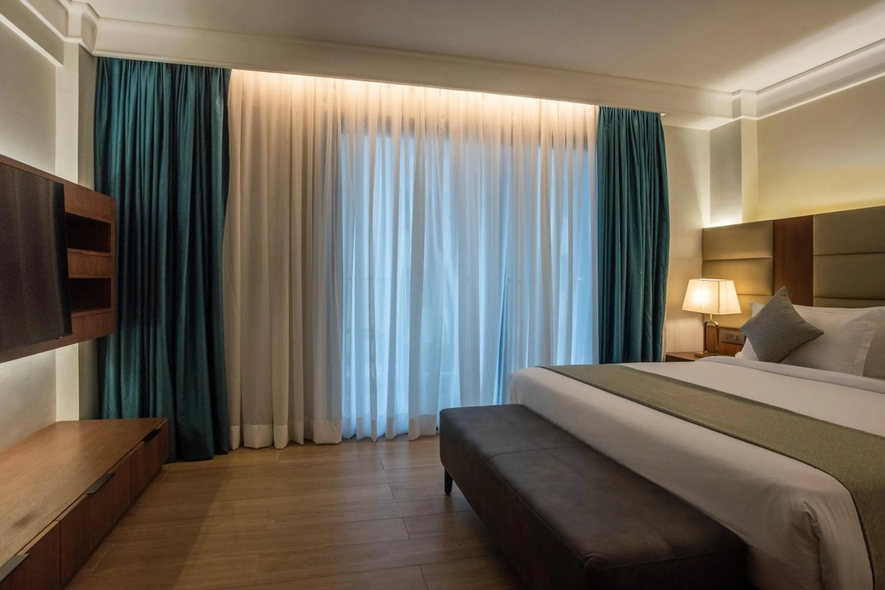 Bed in Okash City Boutique Hotel