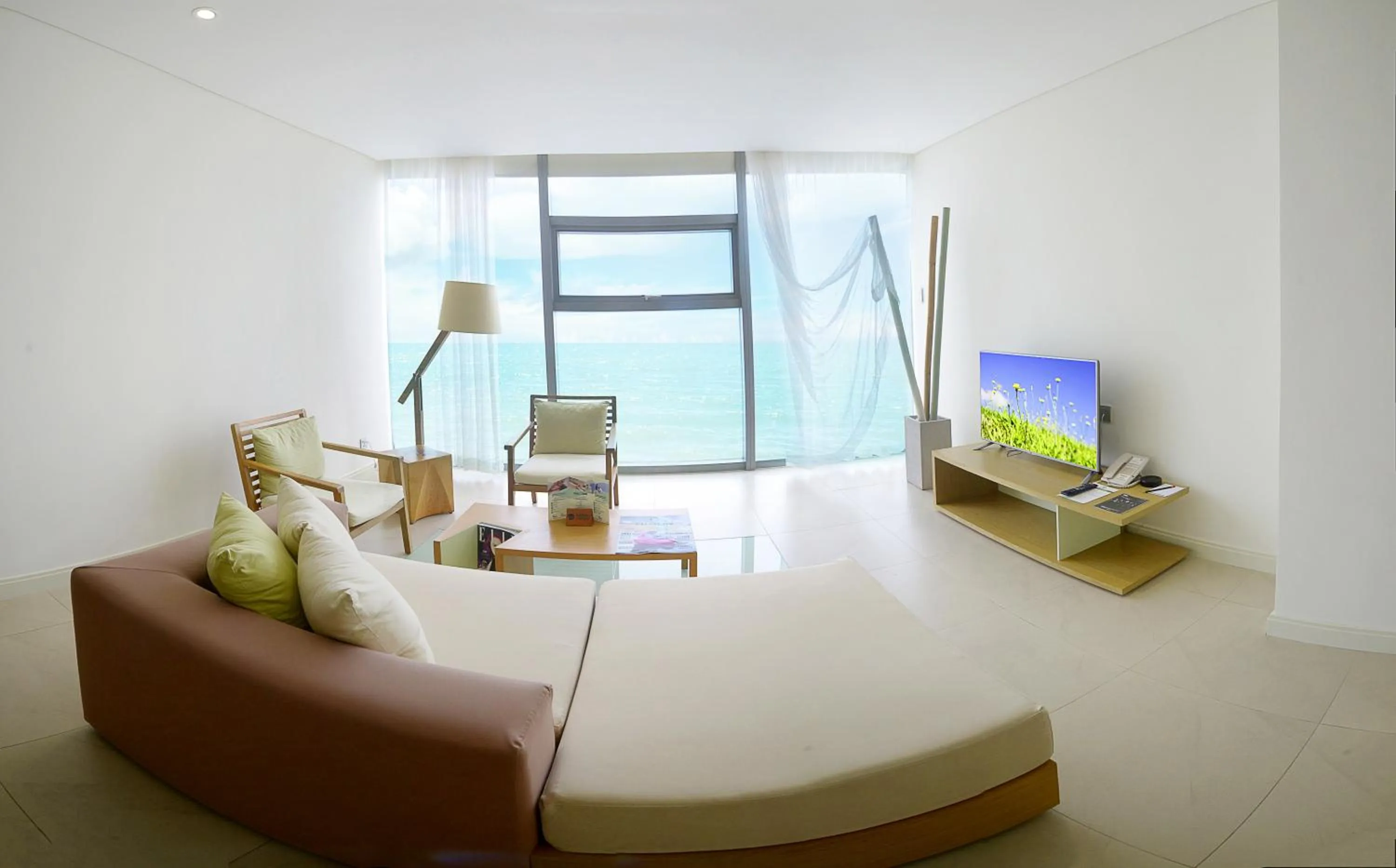 Living room, Bed in Fusion Suites Da Nang