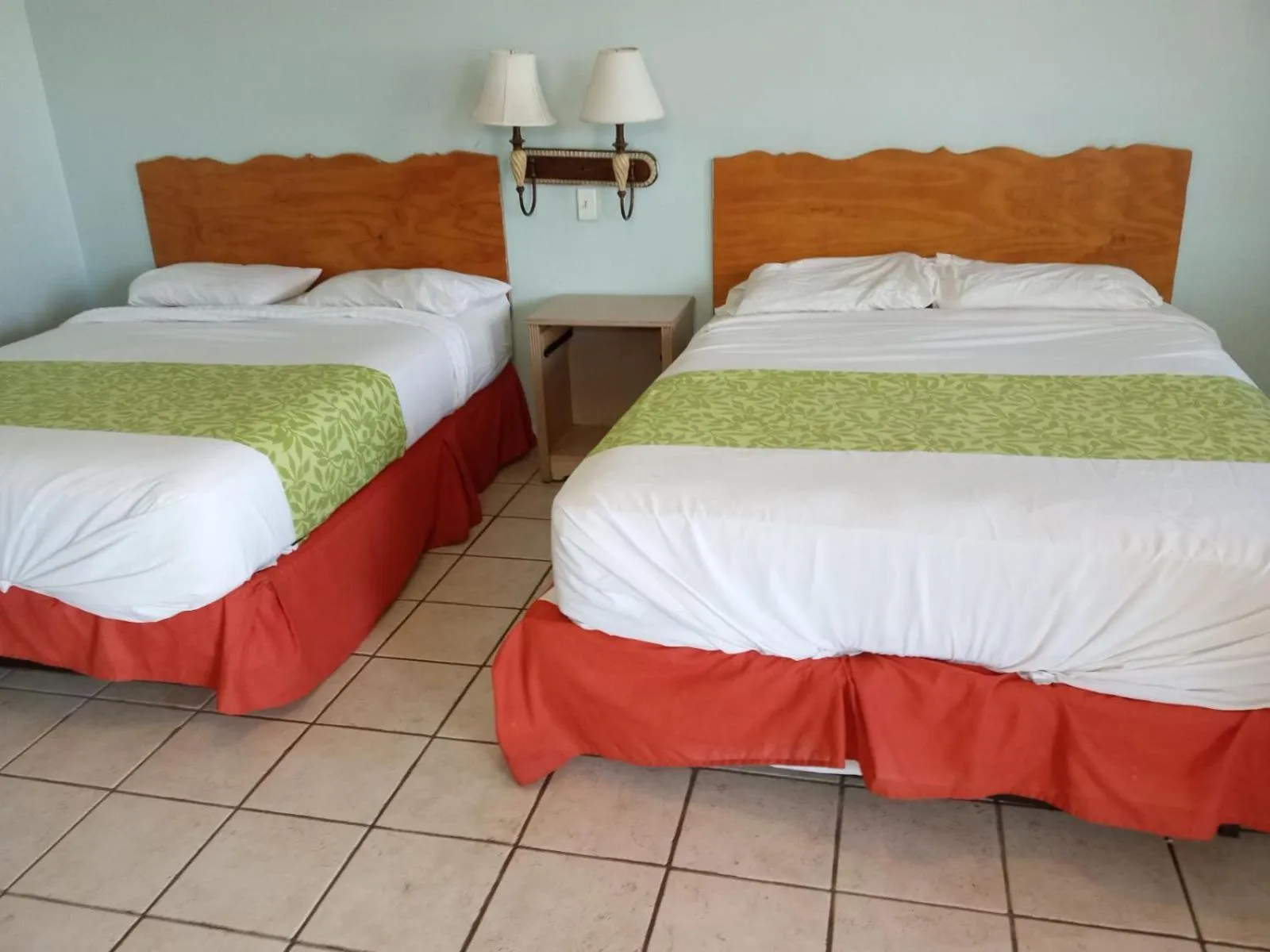 Bed in Dixie Plaza Hotel