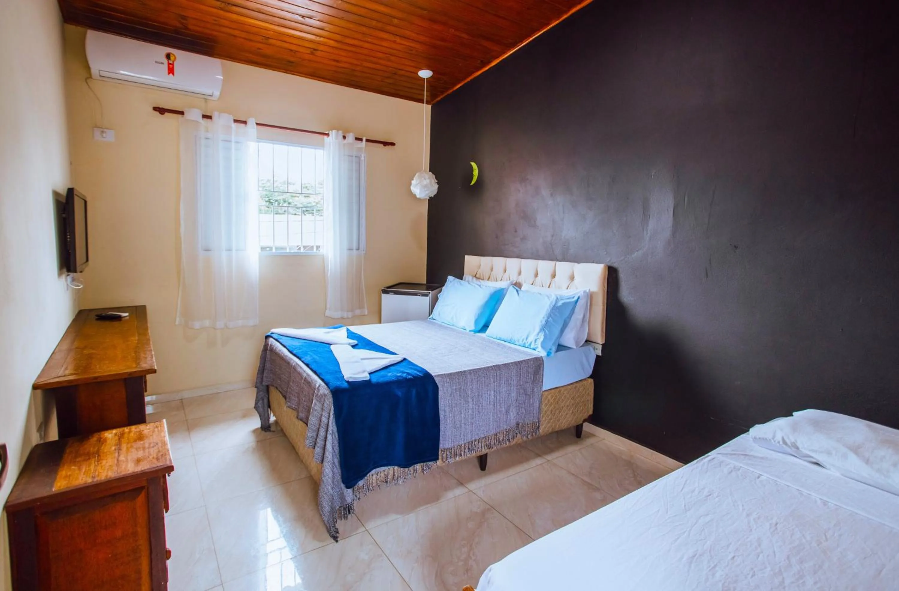 Bed in VELINN Pousada Praia do Perequê