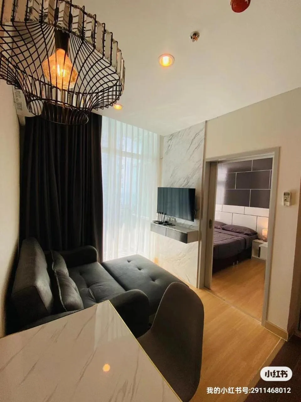 Living room, Bed in The Grand Jomtien Condo