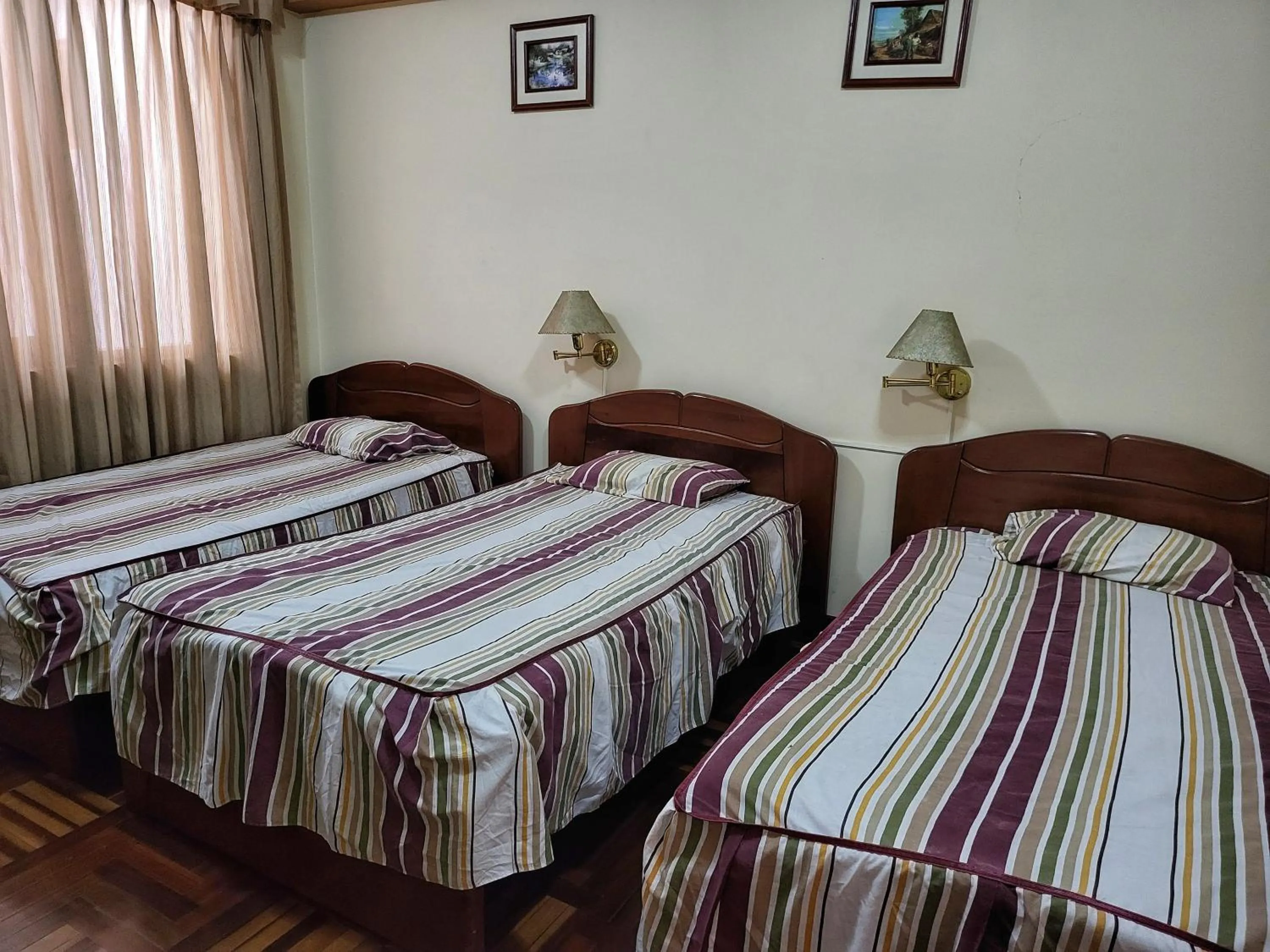 Bed in D'Cardenas Hotel