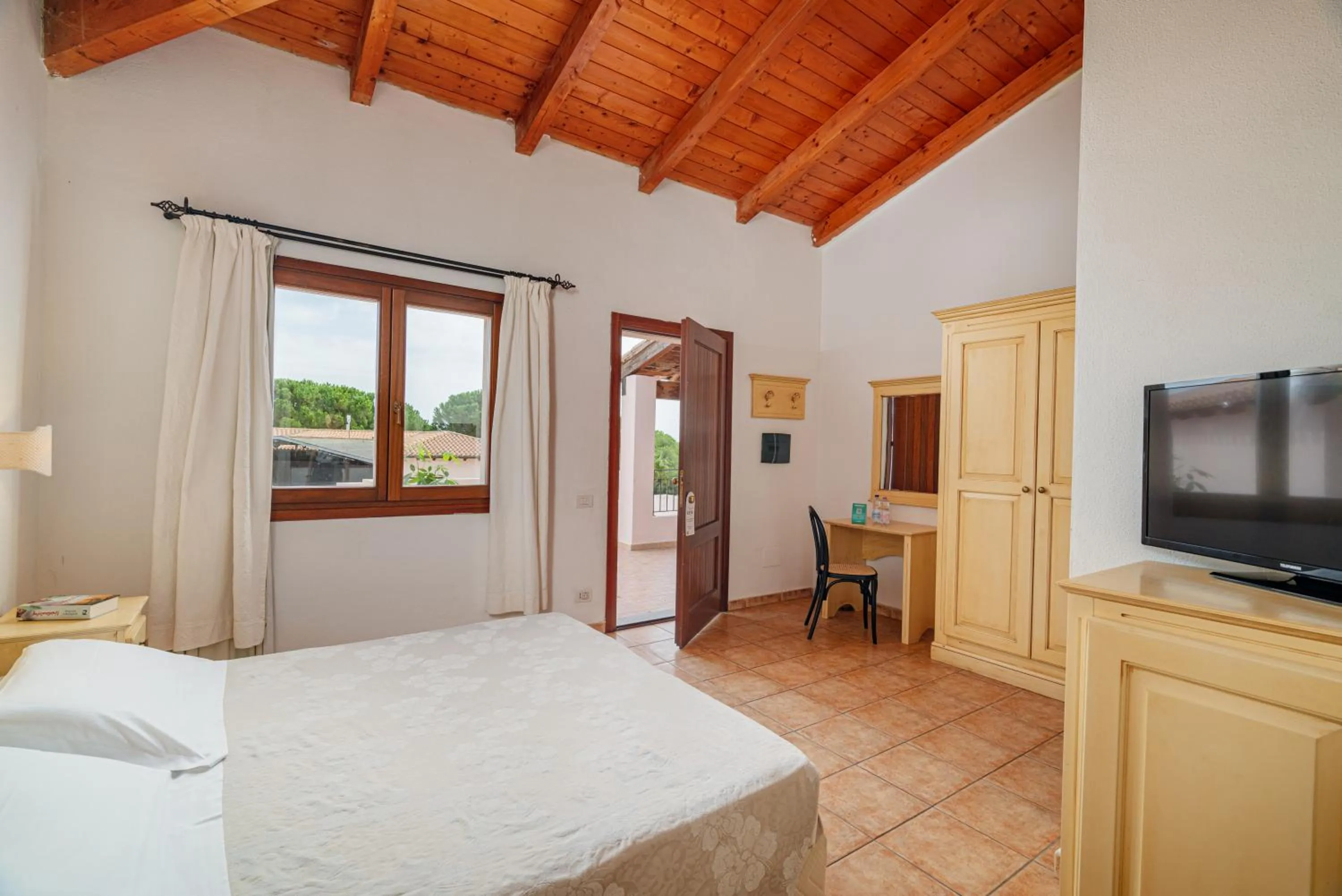 Photo of the whole room, Bed in Club Esse Cala Gonone