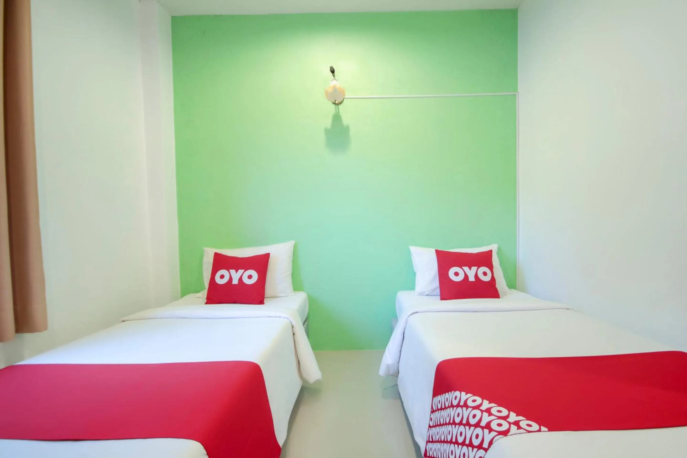 Bedroom in OYO 1120 The Royhanna Beach Home