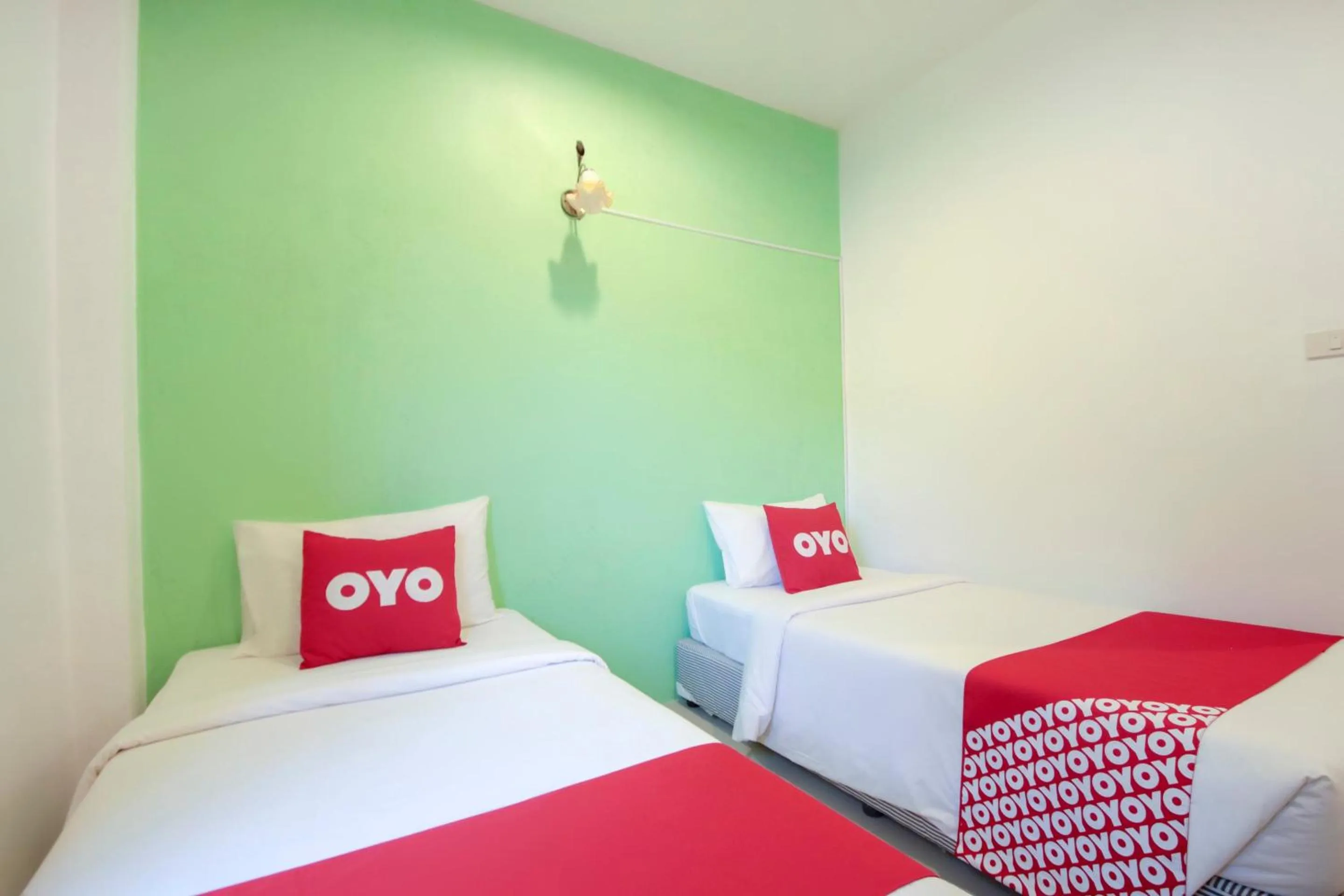 Bedroom in OYO 1120 The Royhanna Beach Home