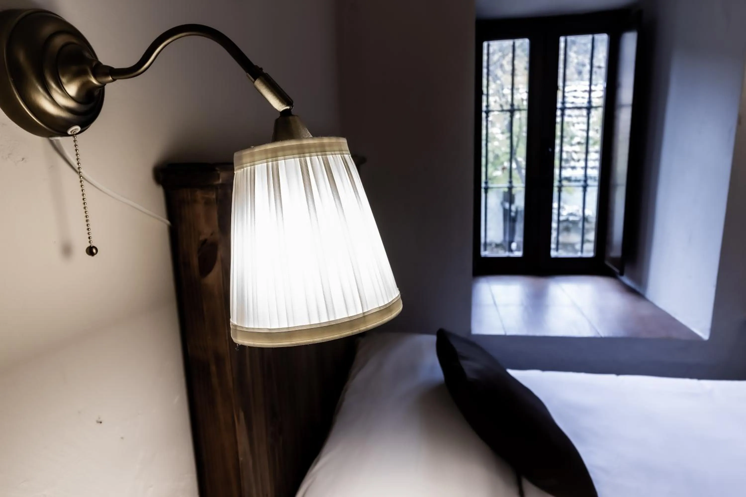 Decorative detail, Bed in Posada Peña Pintada by Vivere Stays