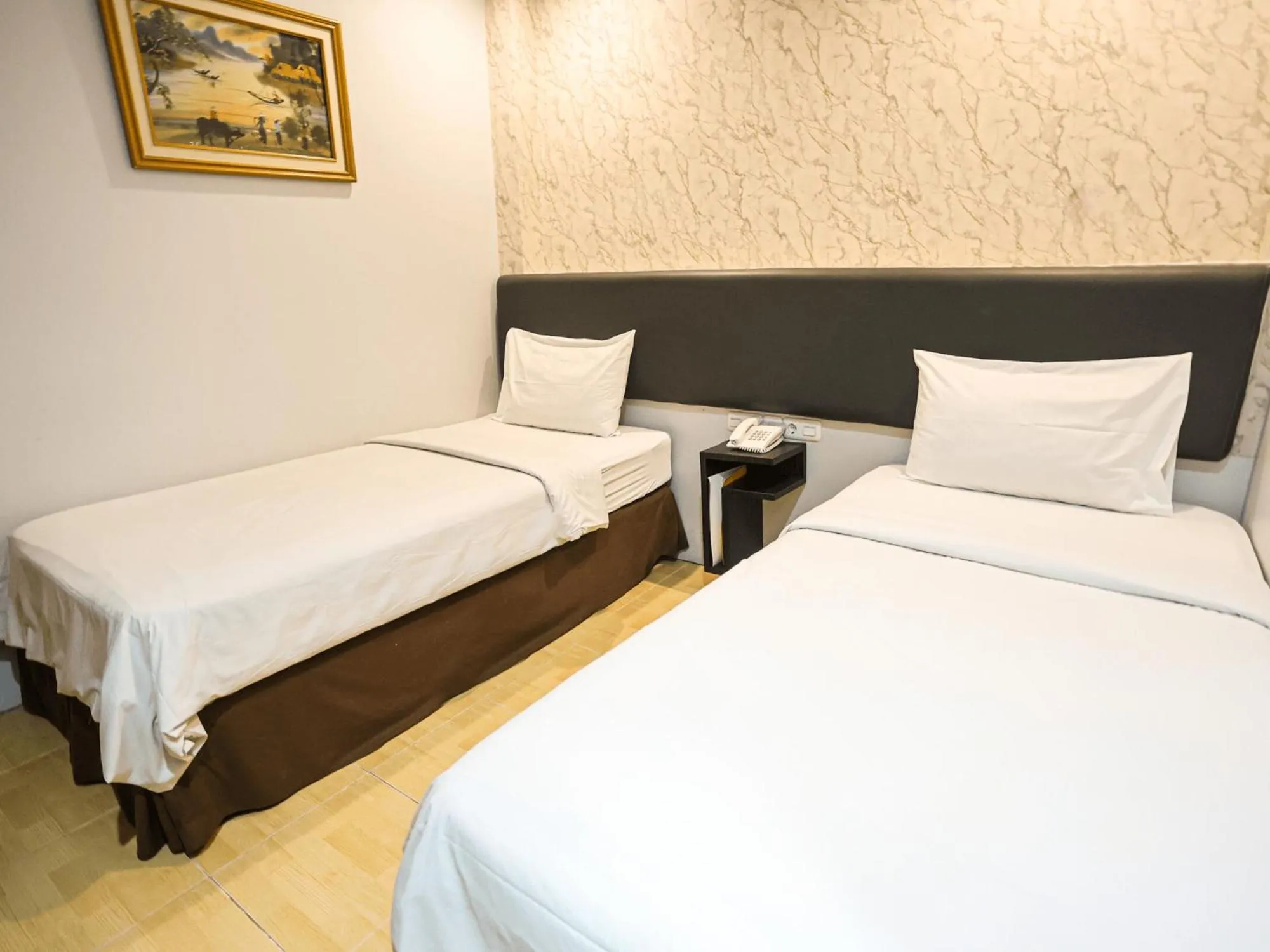 Bed in Grande Hotel Lampung Powered by Archipelago